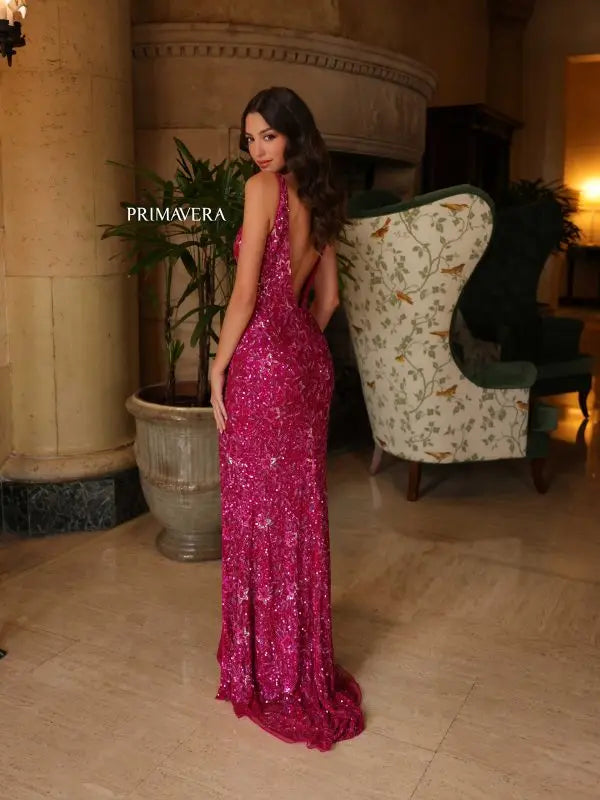 Elevate your fashion game with the stunning Primavera Couture 4153 Long Prom Dress. The elegant V-neck and high slit add a touch of sophistication, while the open back and sequin details make a bold statement. Perfect for formal events and pageants, this fitted gown will make you stand out from the crowd.