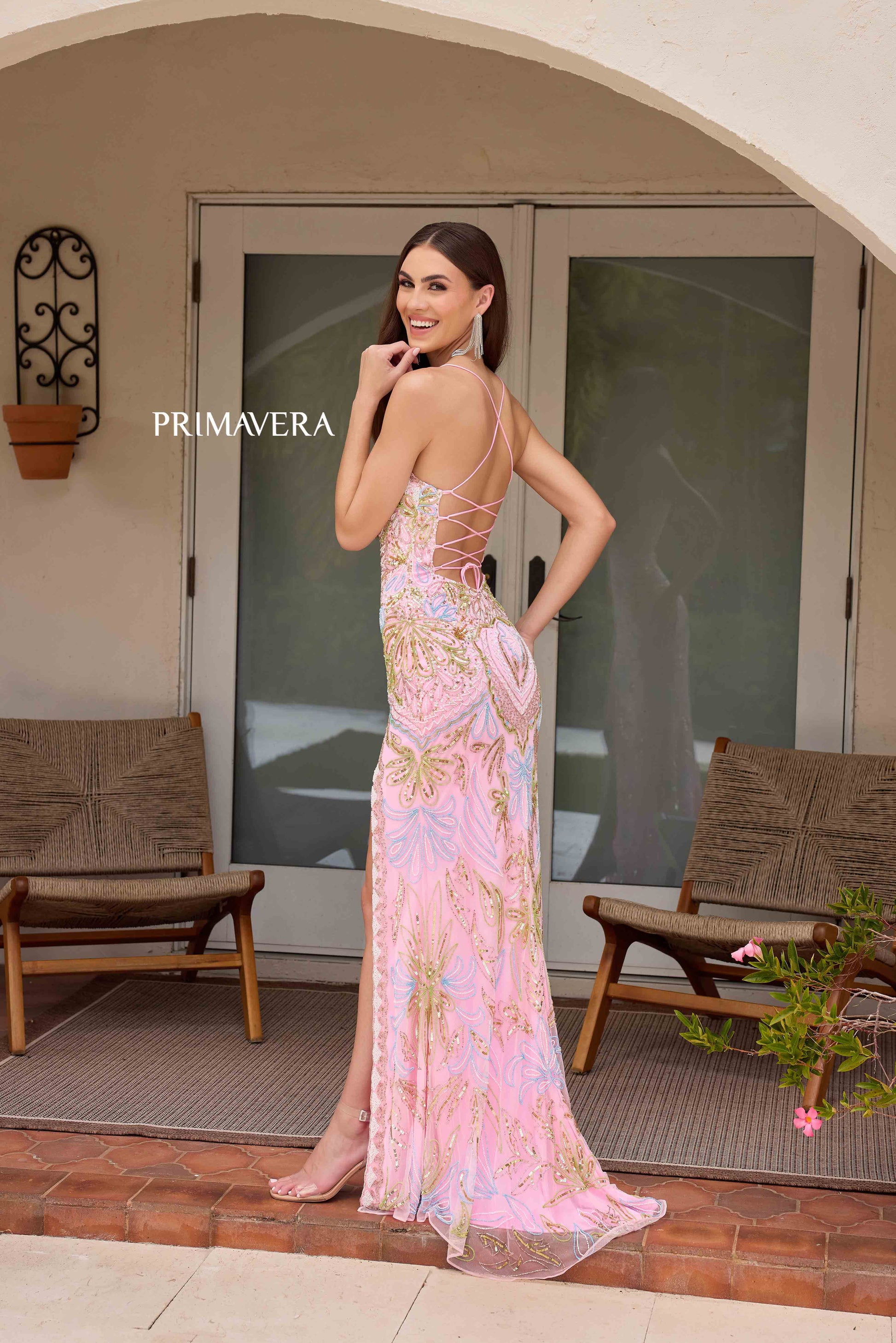 This Primavera Couture 4156 Long Prom Dress is the perfect choice for a sophisticated and glamorous look. With a fitted silhouette and scoop neck, this dress accentuates your curves while the sequin details add a touch of sparkle. The lace-up back and high slit provide a flattering and elegant touch, making it a must-have for formal occasions and pageant events.