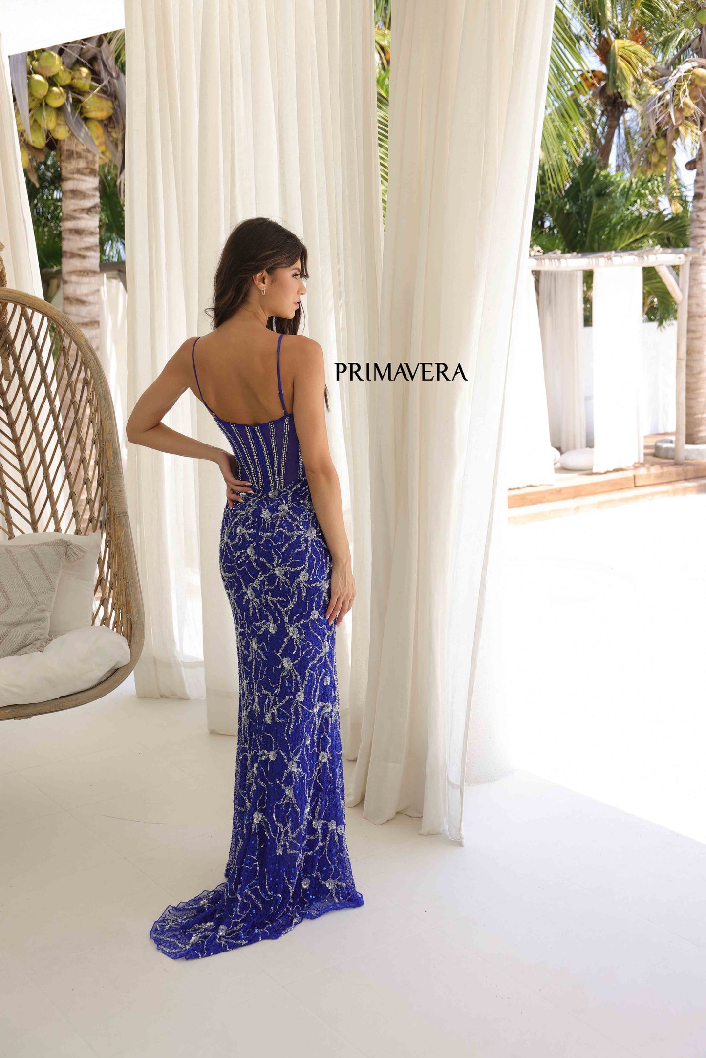 Elevate your prom or pageant look with the stunning Primavera Couture 4307 dress. The sheer paneling and crystal corset add a touch of elegance, while the sequin and bead detailing provide a subtle shimmer. With a flattering slit, this dress is both glamorous and effortlessly chic.