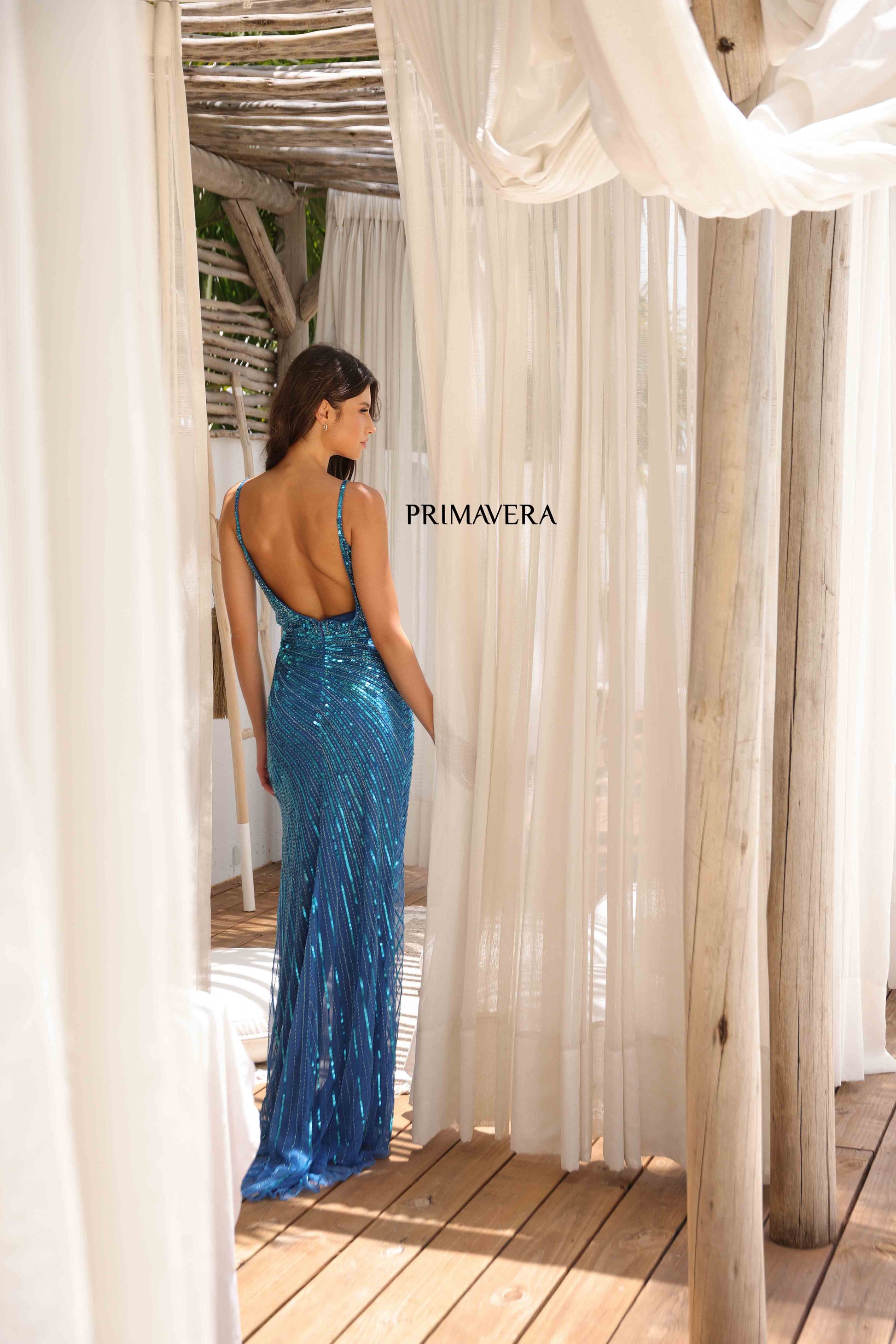 Elevate your style with the Primavera Couture 4325 Prom Dress. This stunning, beaded gown features a wrap design with a daring slit and a backless, V-neck silhouette. Step out in confidence and turn heads at any formal event.

Sizes: 000-18

Colors: Black, Peacock, Platinum, Red