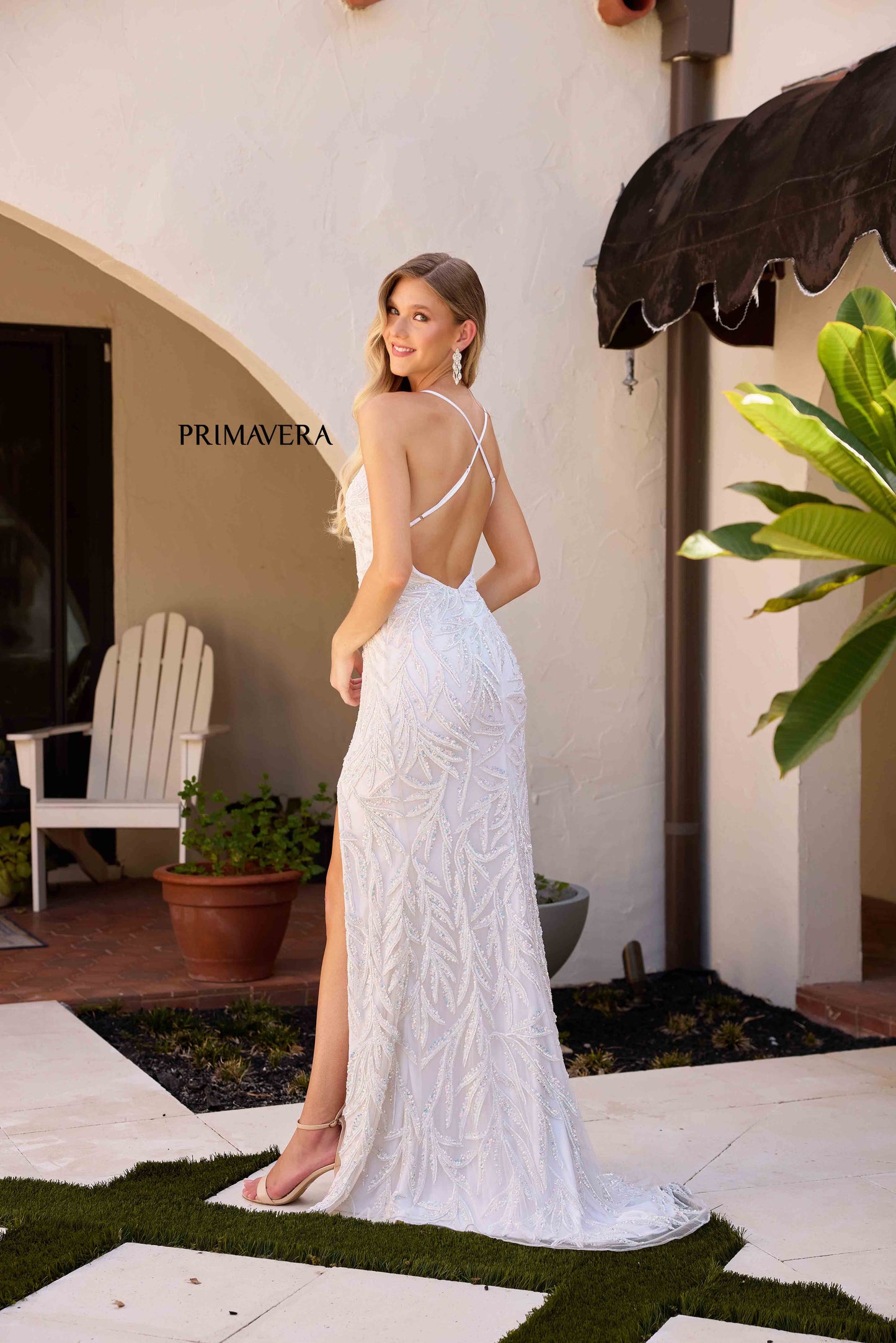 This stunning Primavera Couture 4332 gown features intricate beading, a sultry backless design, and a high slit for added drama. The elegant V-neckline completes the look, making it perfect for formal events. Get ready to turn heads and feel confident in this exquisite dress.

Sizes: 000-18

Colors: Ivory, Midnight, Peacock