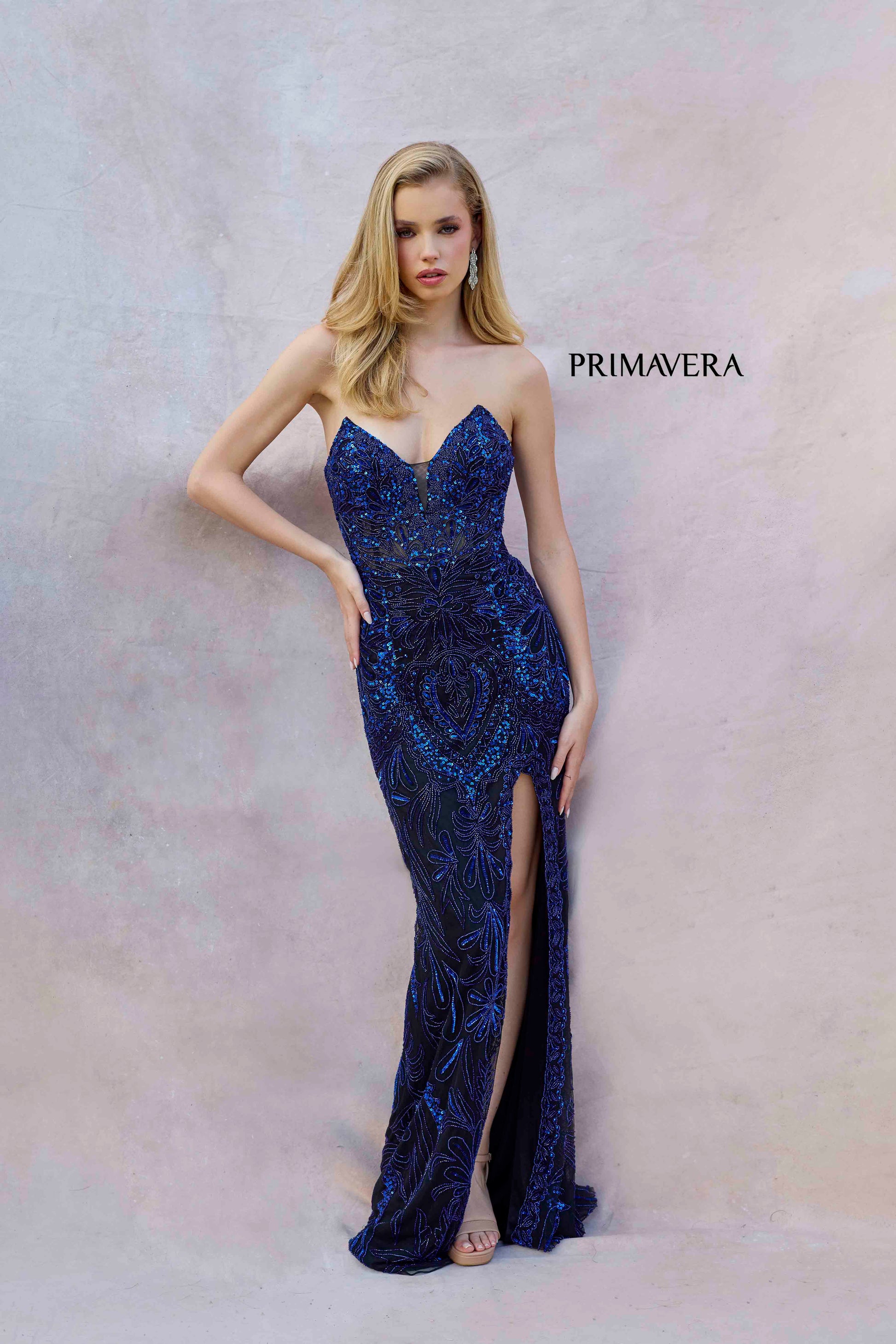 Elevate your prom or pageant look with the Primavera Couture 4343 dress. The long, beaded design features a v-neckline and corset bodice for a flattering, form-fitting silhouette. A high slit and sequin details add a touch of glamour to this elegant gown. Perfect for making a statement at your next event.