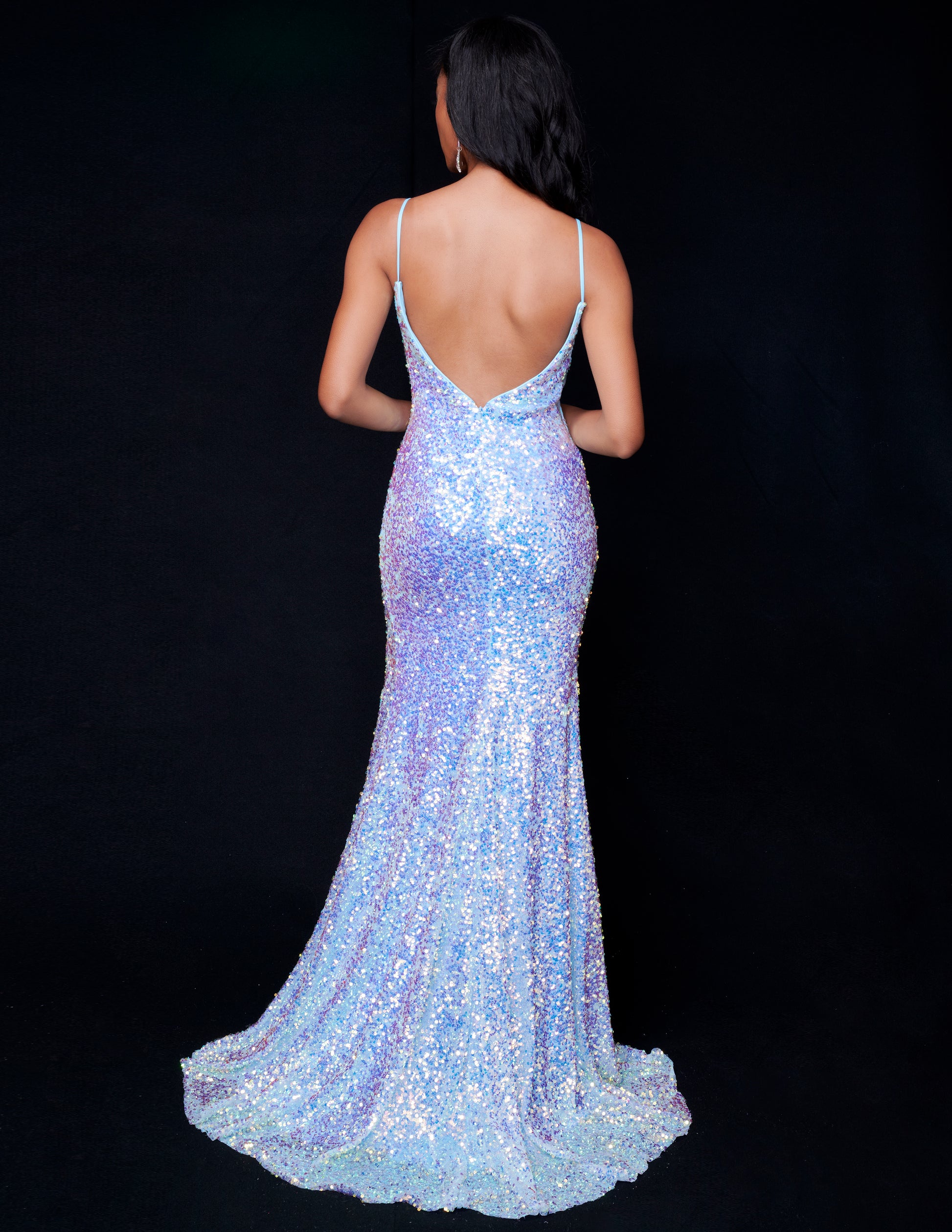 This fitted sequin long prom dress by Nina Canacci 4410 is designed to make you stand out on the dance floor. With a low back and V neck, this elegant gown features a stylish slit that will add an extra touch of sophistication to your look. Perfect for any formal occasion, this dress is sure to make you feel confident and glamorous.