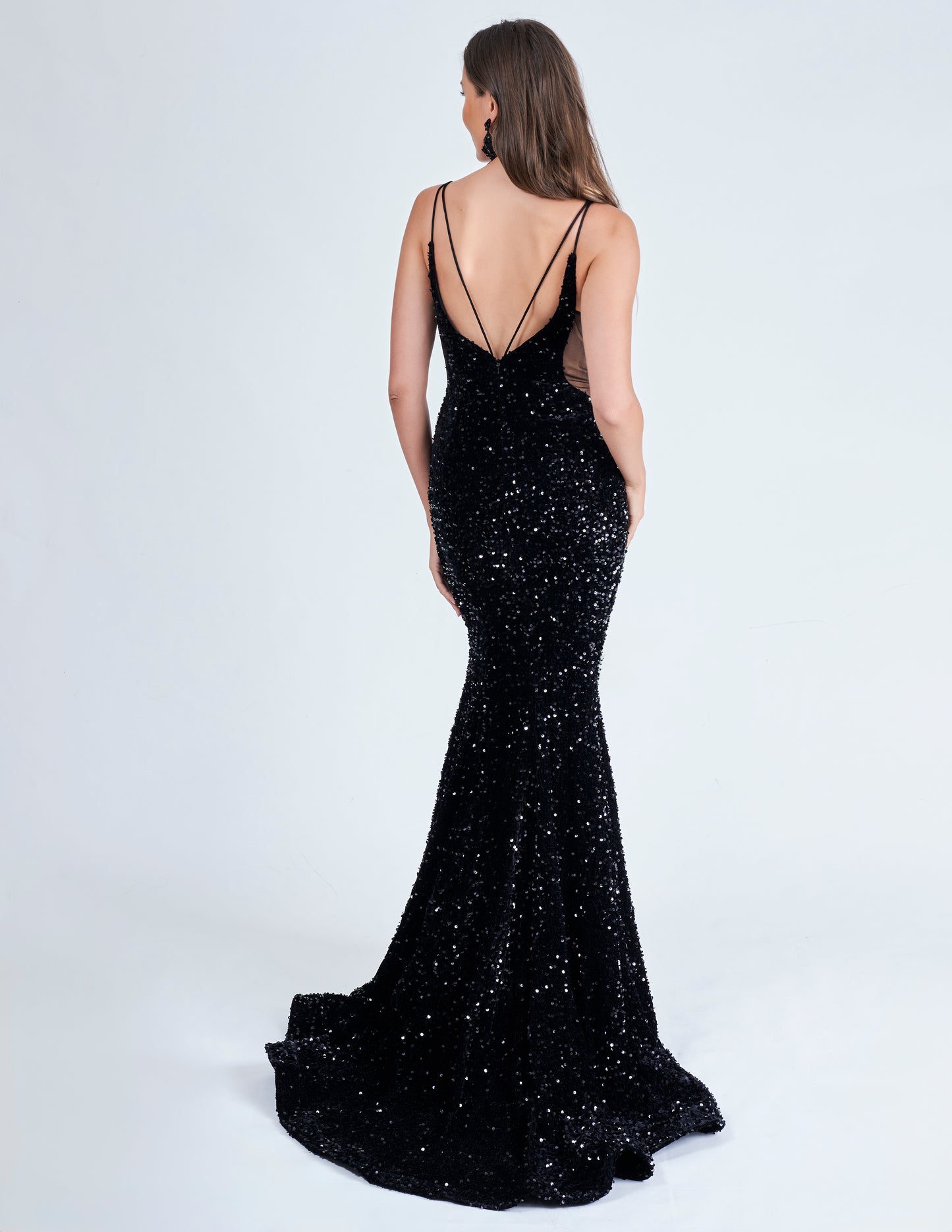 Elevate your style with the Nina Canacci 4420 Velvet Sequin Mermaid Prom Dress. Featuring a striking sheer v-neckline and stunning velvet sequin design, this formal evening gown is sure to make a statement. With its flattering mermaid silhouette, it's the perfect choice for a prom or special occasion.