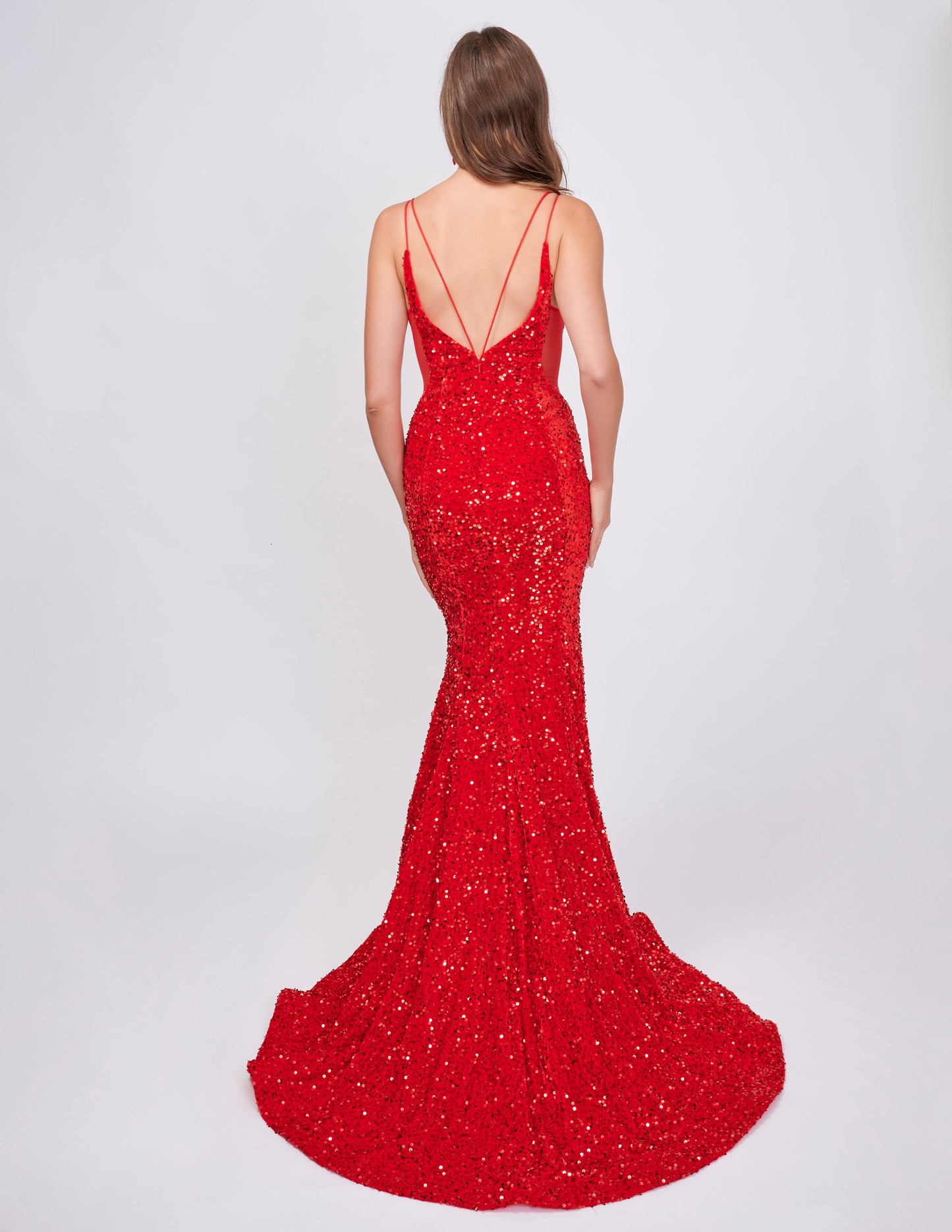 Elevate your style with the Nina Canacci 4420 Velvet Sequin Mermaid Prom Dress. Featuring a striking sheer v-neckline and stunning velvet sequin design, this formal evening gown is sure to make a statement. With its flattering mermaid silhouette, it's the perfect choice for a prom or special occasion.