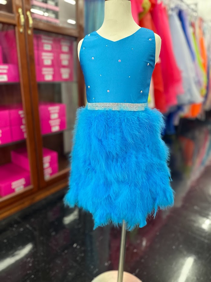 Marc Defang 5072 This is a short dress for girls and preteens pageant dresses.  It has a modest scoop neckline with embellishments throughout and a crystal waistline.  It stands out because it has a feather skirt.  Available colors:  Frozen Blue  Available sizes:  4, 8