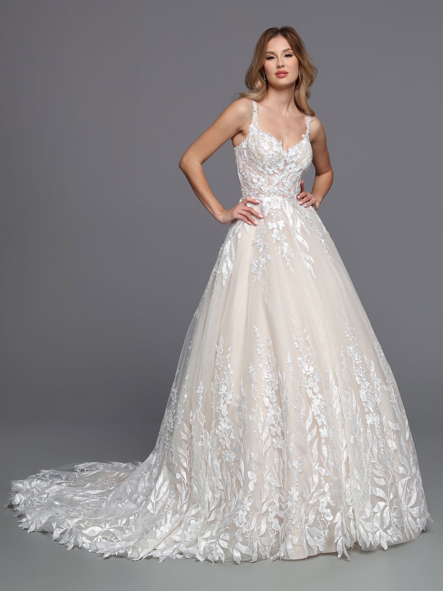 DaVinci Bridal 50751 A-Line Ballgown Sweetheart Neckline Tulle Lace Appliques Sheer Open Back Wedding Gown. The modern lines of this tulle and lace ball gown are softened by blossom and vine lace that wraps the bodice and trails down the skirt to create a textured hem for the chapel train.