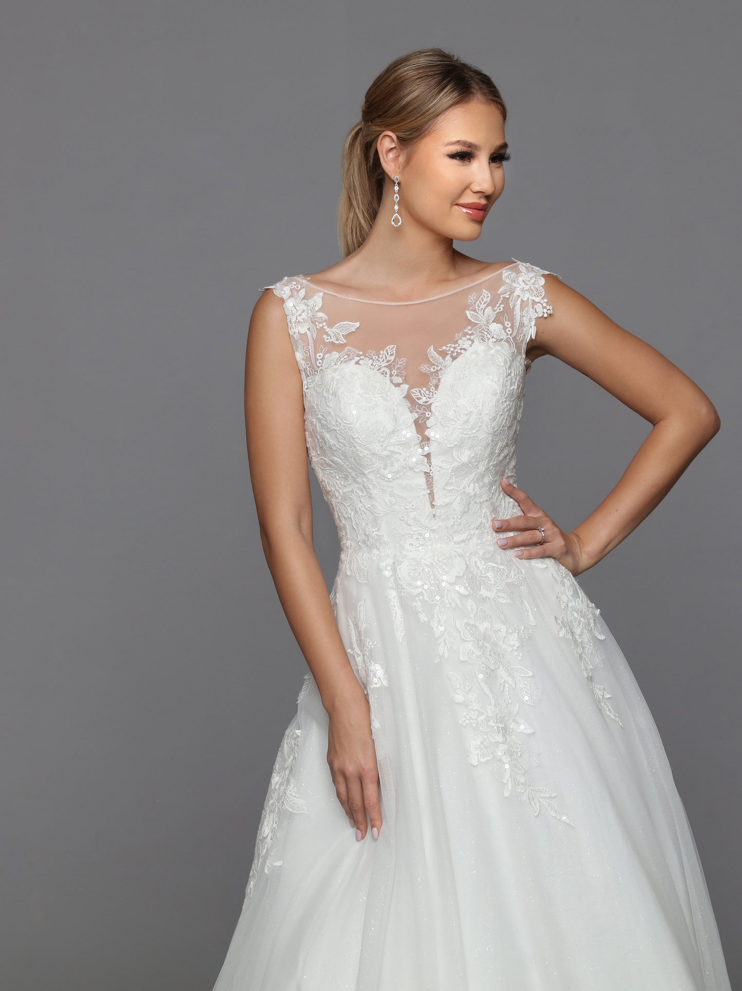 DaVinci Bridal 50769 A-Line Ballgown Illusion High Neck Long Sleeve Floral Lace Train Wedding Gown. Convertible dresses are always on-trend, like this lush ball gown with sheer full-length sleeves highlighted with rich lace applique. The alluring low scoop back is balanced by the modest bateau neckline.