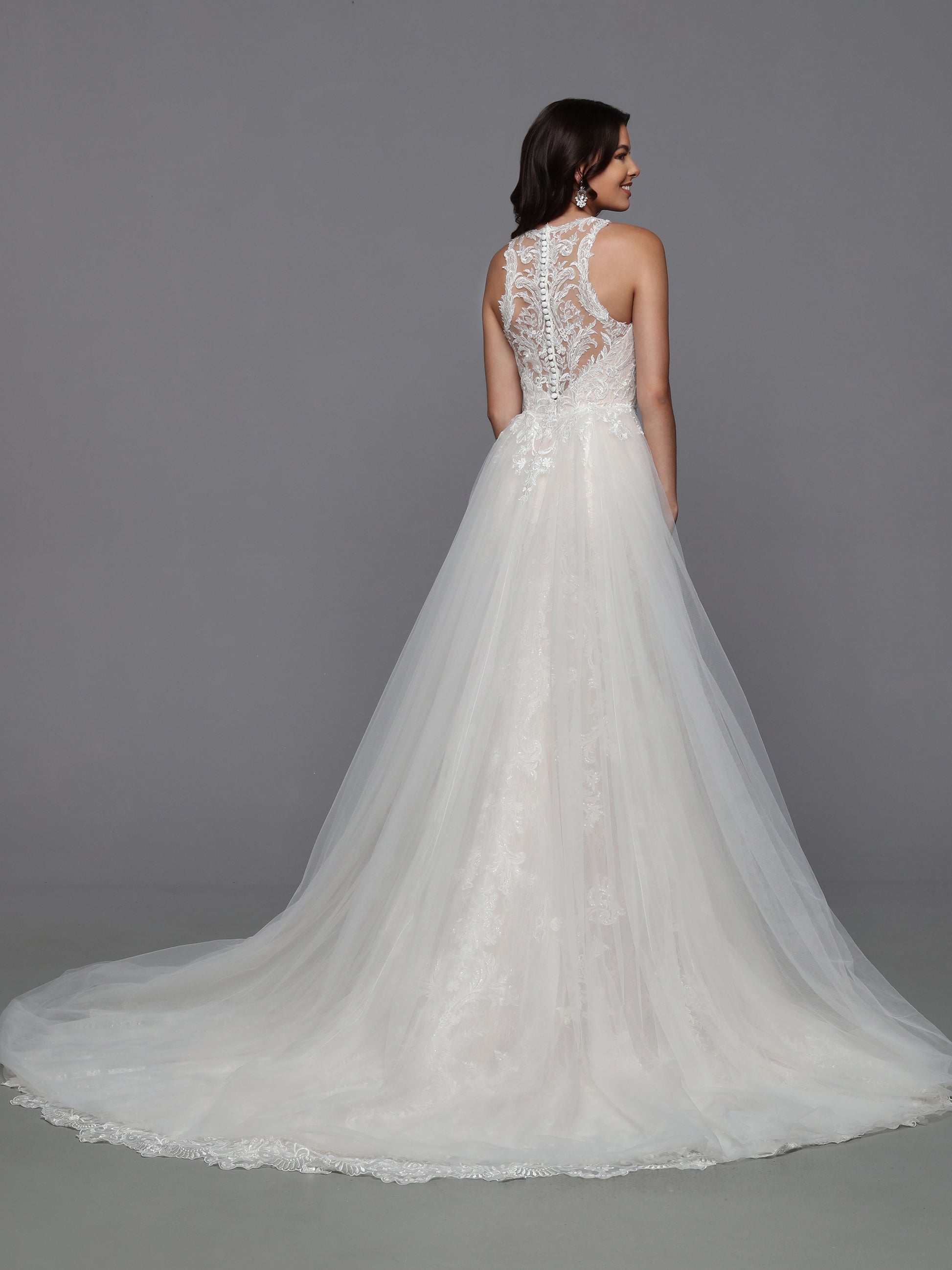 DaVinci Bridal 50783 Mermaid Fit And Flare Lace V-Neck Detachable Train Wedding Gown. What could be better than a delicious lace mermaid wedding dress? A mermaid dress with a removable ball gown bridal skirt! The sheer lace racerback bodice and lace-edged train make this look practically perfect.