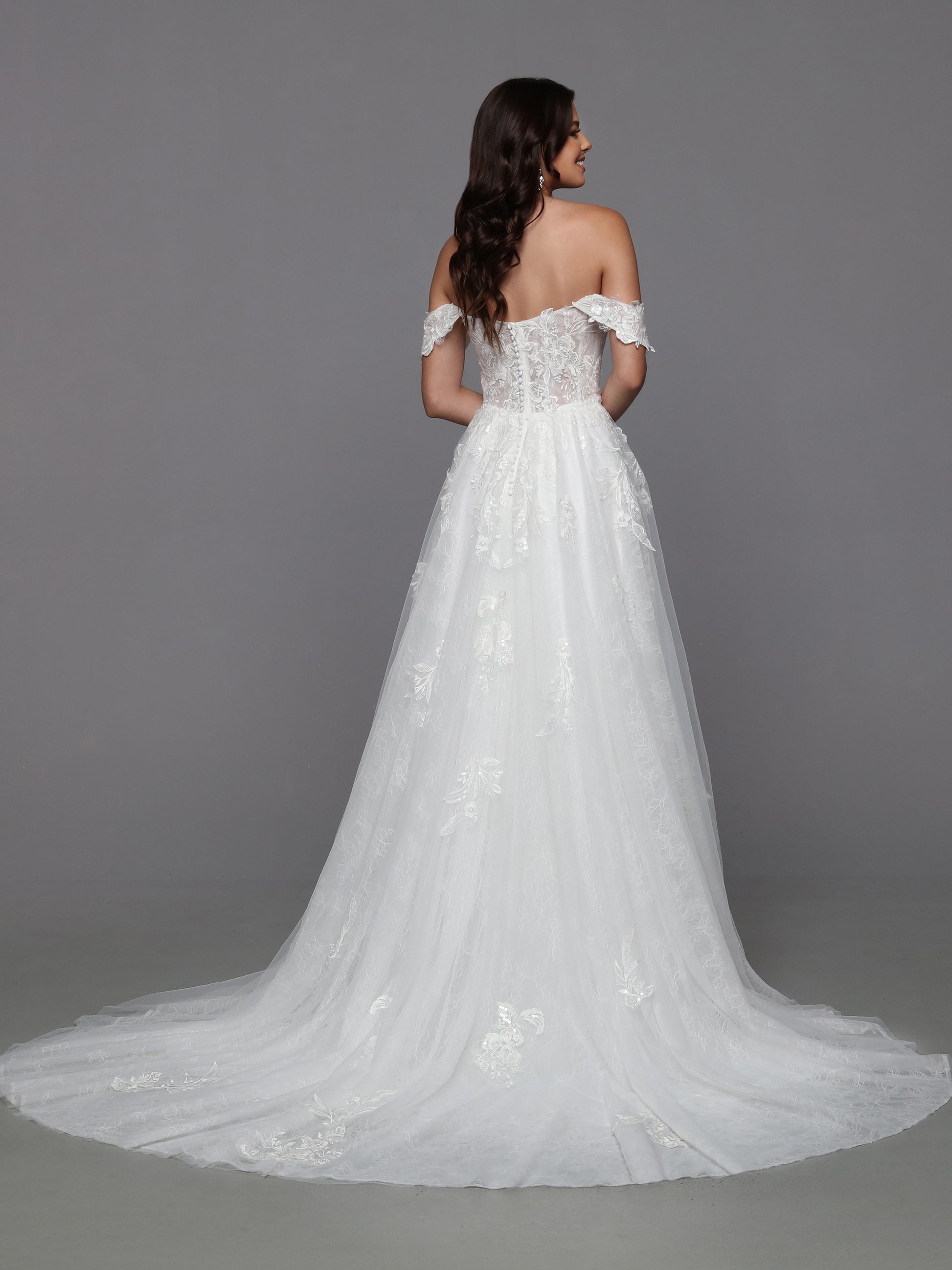 Look effortlessly feminine on your big day with Davinci Bridal 50787 Long Lace A Line wedding dress. Crafted with an off-the-shoulder bodice and sheer skirt adorned with delicate lace applique, the fitted bodice features a beaded front and back that adds a touch of glamour. Perfect for a romantic, yet modern look!  Sizes: 2-20  Colors: Ivory