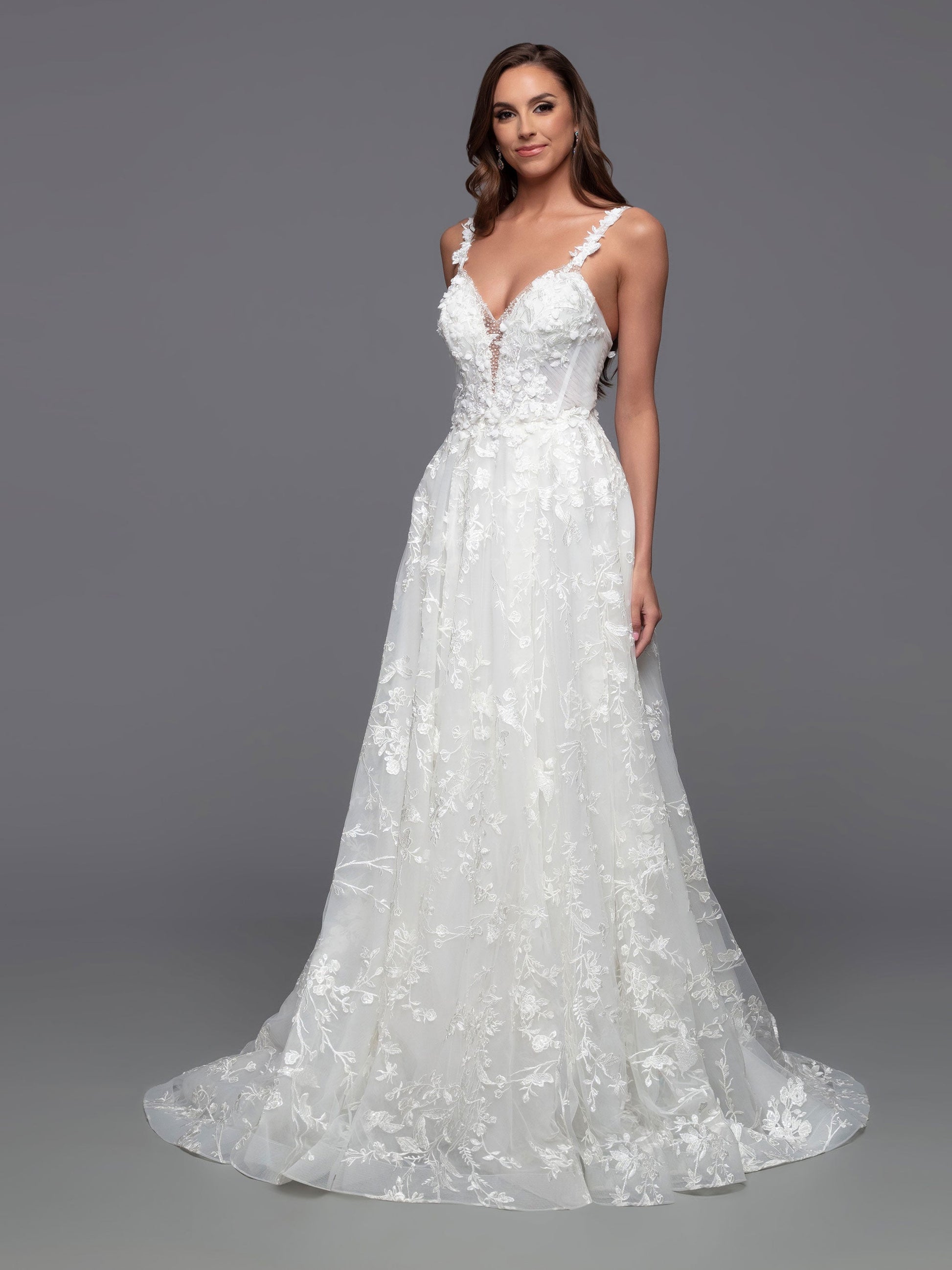 Look stunning on your special day in this Davinci Bridal 50806 A Line Lace Cape Wedding Dress. Constructed with a sheer crystal plunging neckline and 3D floral embroidery on the front and back bodice, this gown provides an exquisite look with gathered skirt and chapel train. Plus, you can customize your look and stand out in photos with the addition of the detachable veil wings.  Sizes: 2-20  Colors: Ivory