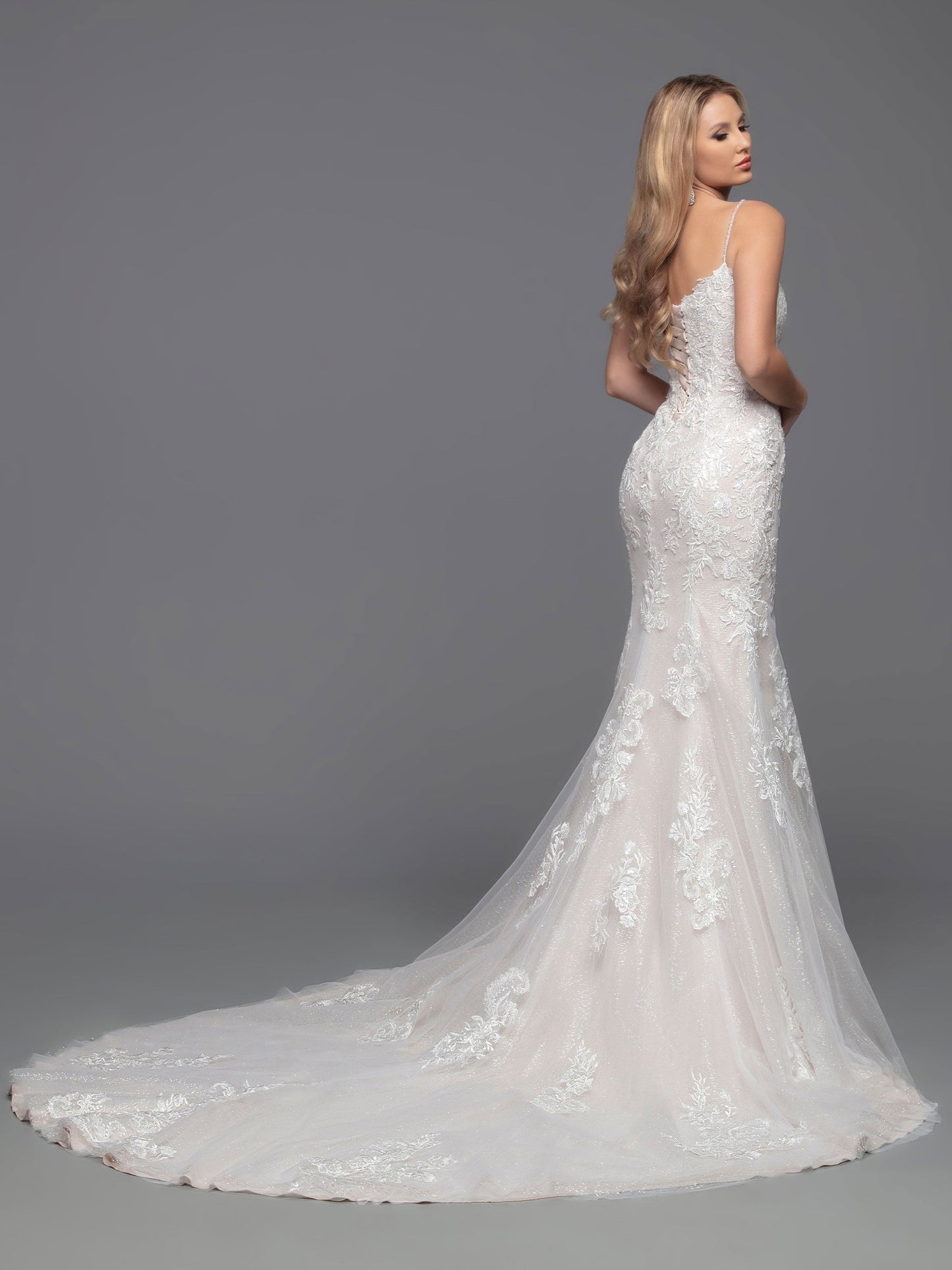 Look beautiful in this classic Davinci Bridal 50809 wedding dress. The tulle and lace fit & flare corset gown features a lace bodice, beaded shoulder straps, and corset back. Detachable full-length sheer lace applique sleeves give you the option to stay warm with full-coverage during the ceremony.  Sizes: 2-20  Colors: Ivory/Blush, Ivory/Ivory