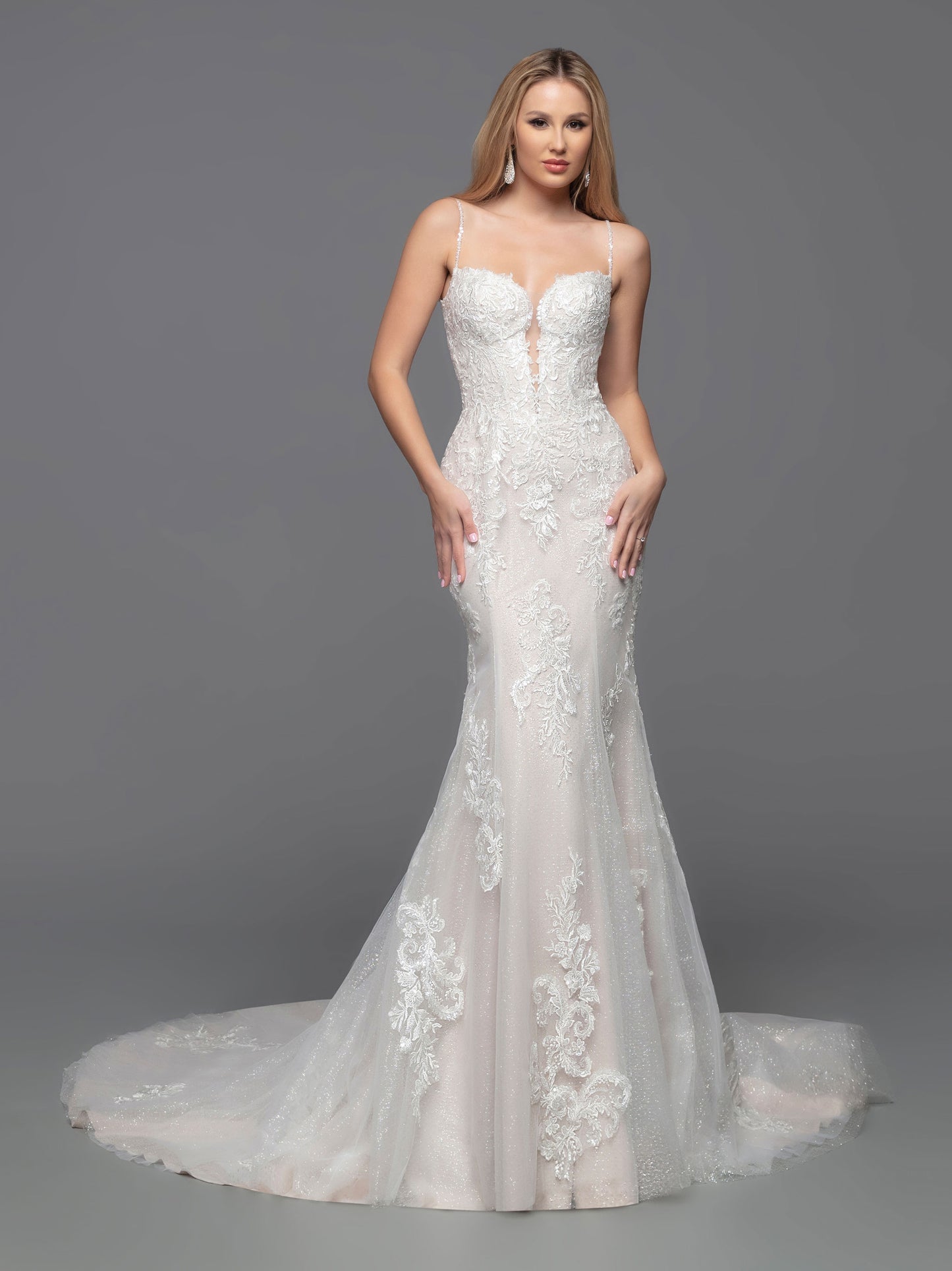 Look beautiful in this classic Davinci Bridal 50809 wedding dress. The tulle and lace fit & flare corset gown features a lace bodice, beaded shoulder straps, and corset back. Detachable full-length sheer lace applique sleeves give you the option to stay warm with full-coverage during the ceremony.  Sizes: 2-20  Colors: Ivory/Blush, Ivory/Ivory