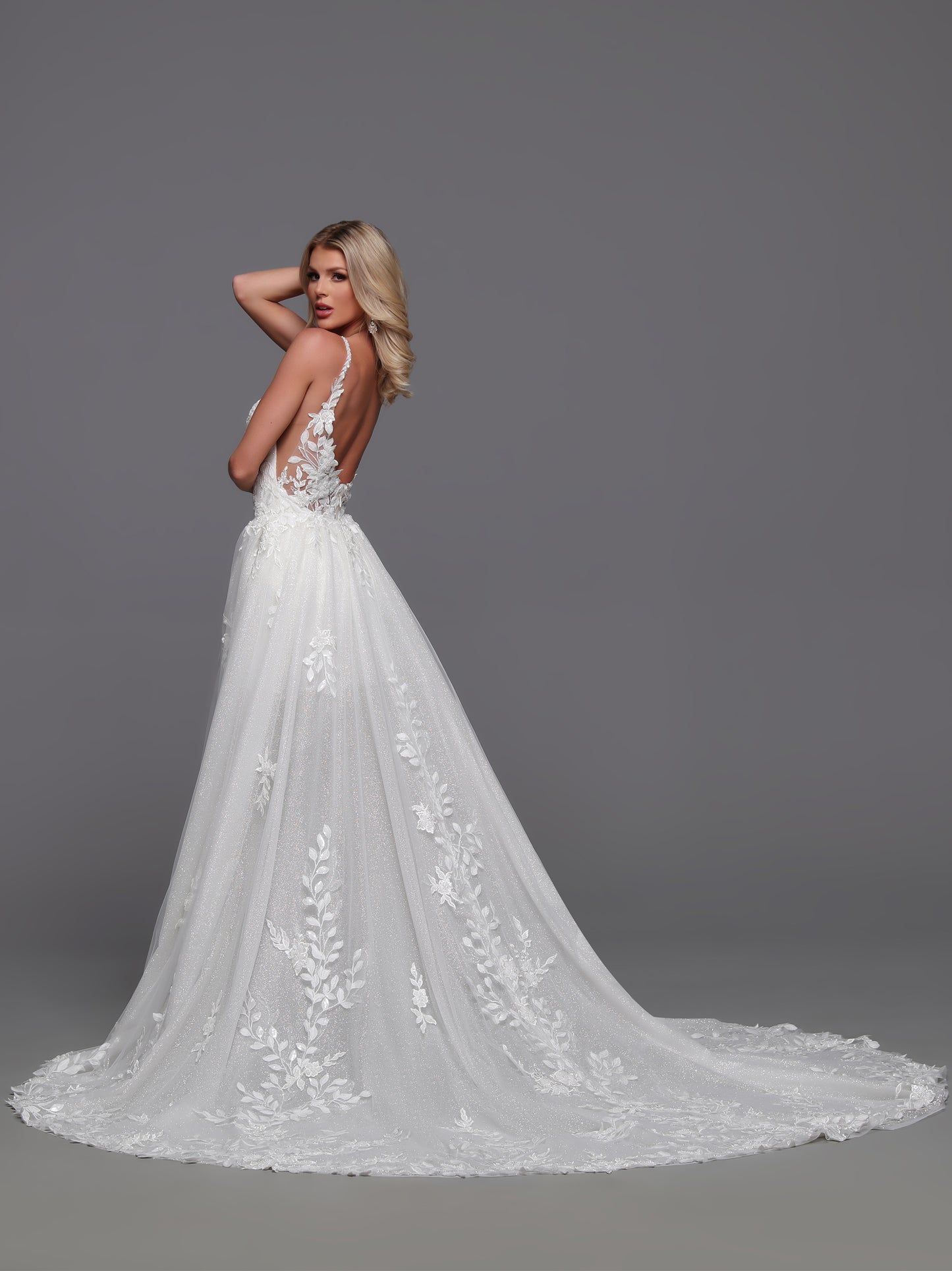 Exude elegance and sophistication with our Davinci Bridal 50872 Convertible Wedding Dress. This stunning gown features a detachable a-line overskirt, delicate lace details, and shimmering sequins. Transform your look from ceremony to reception with ease. Perfect for the modern bride seeking versatility and luxury.