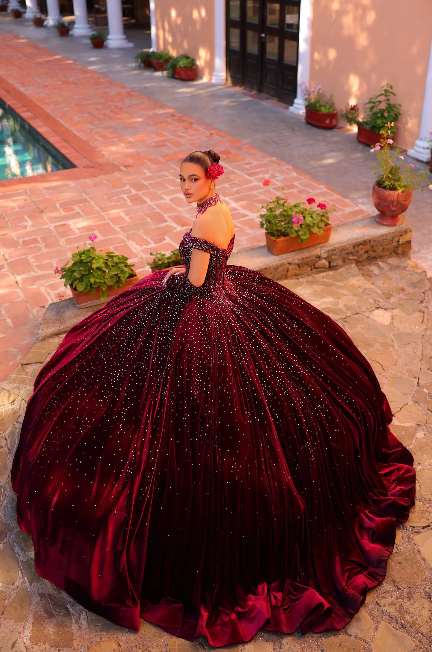 Elevate your quinceanera style with the luxurious Amarra 54257 dress. Made of velvet and adorned with crystal accents, it features a ball gown silhouette with an off-the-shoulder neckline. Complete the look with the included corset necklace and velvet gloves. A perfect choice for a night to remember.