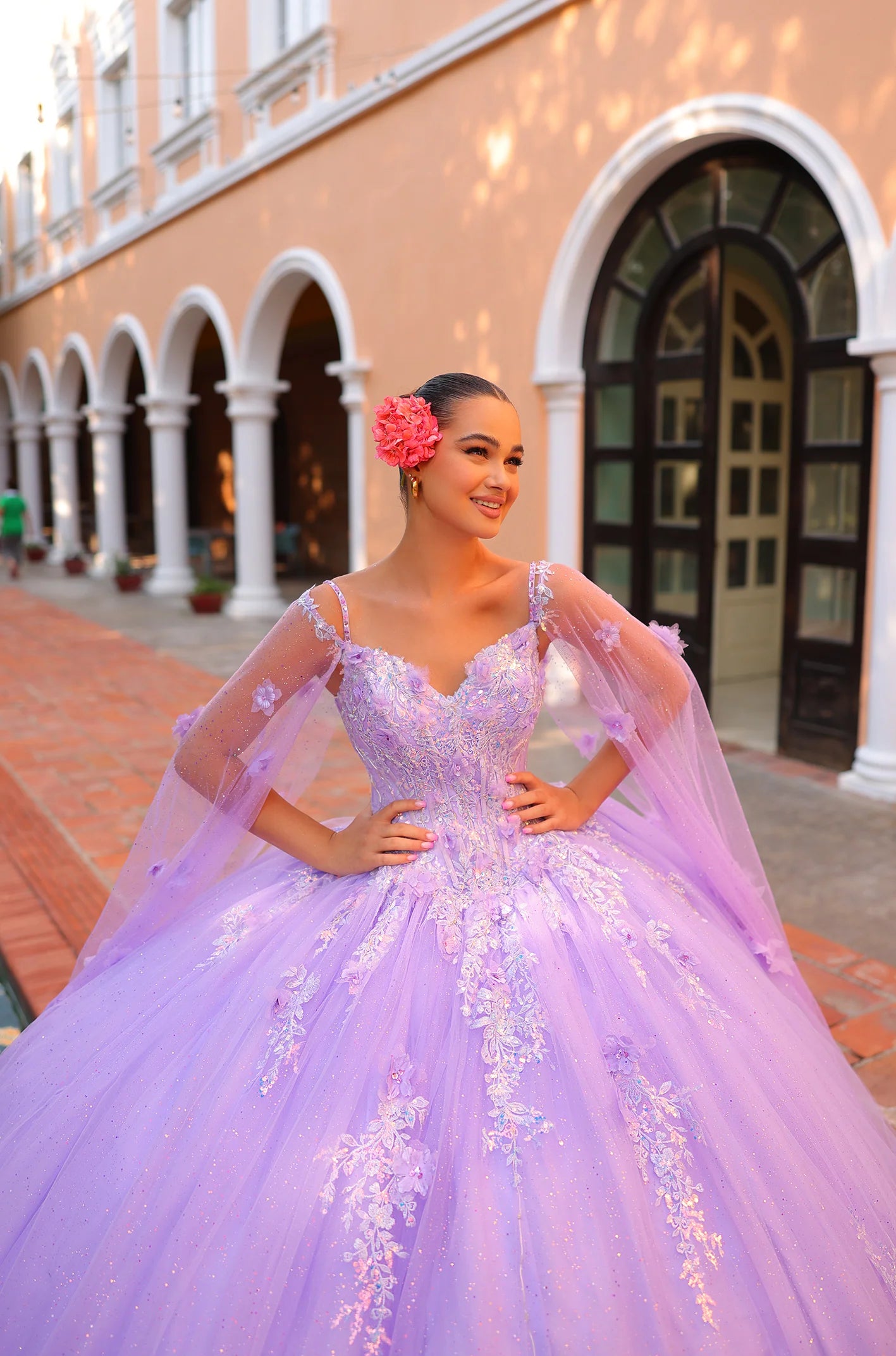 Get ready to turn heads at your Quinceanera with the elegant Amarra 54306 Dress. The beaded lace detailing adds a touch of glamour, while the off-the-shoulder design and ball gown silhouette exude timeless beauty. Complete the look with a matching cape for a stunning ensemble.