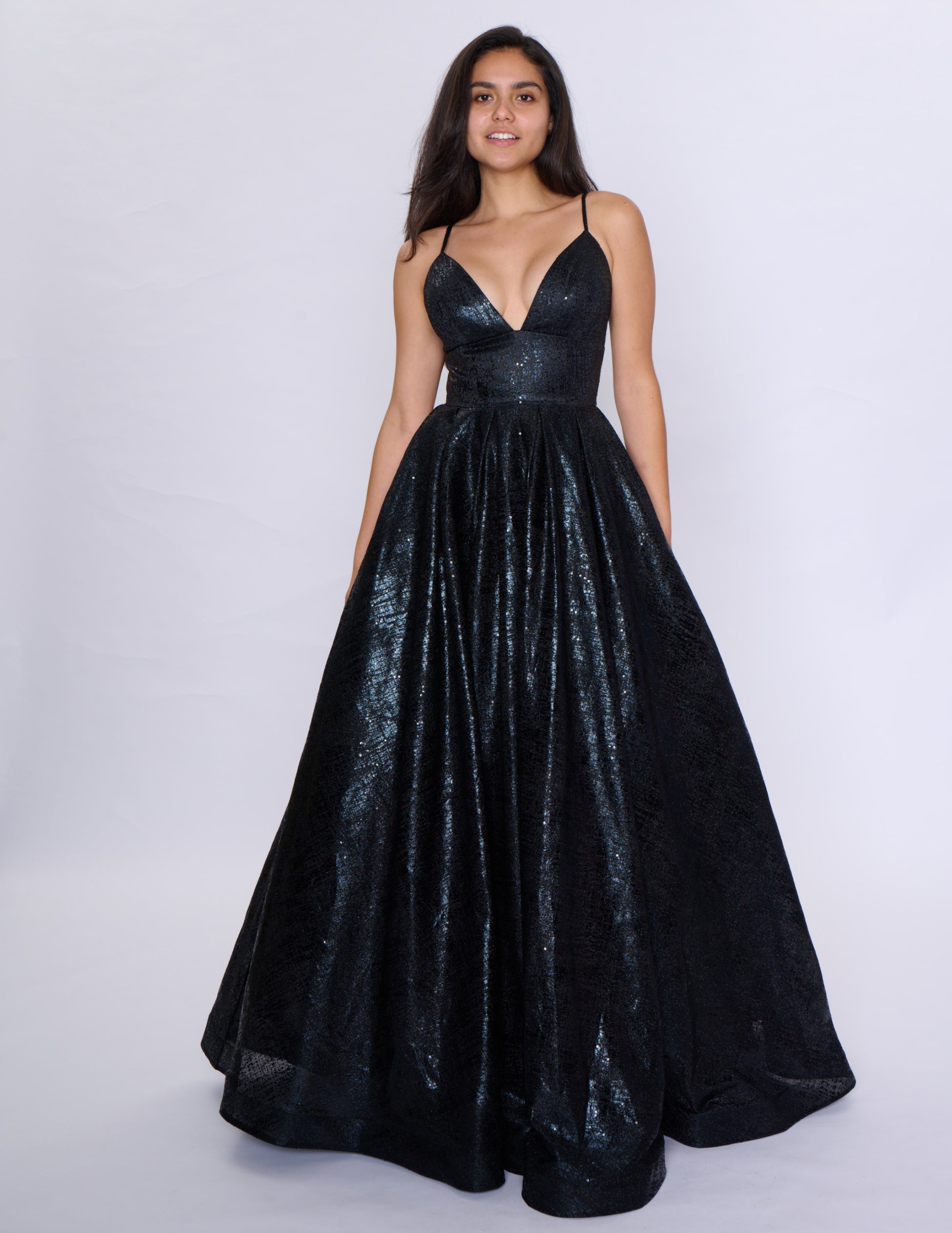 Elevate your formal attire with the Nina Canacci Metallic Ballgown. Stunningly designed with a corset-style bodice and V-neckline, this A-line gown exudes elegance and grace. Made with a metallic fabric, it adds a touch of shimmer to your look. Perfect for prom or any formal event, this dress will make you feel like royalty.

Sizes: 2-18

Colors: Black, Aqua, Rose