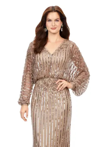 Ashley Lauren 11302 Dolman Sleeve V-Neck Fully Hand Beaded Floral Pattern Waistline Gown. This stunning sequin gown features gorgeous beading throughout and an elegant floral pattern at the waistline. With dolman sleeves, this v-neckline gown is perfect for your next event.