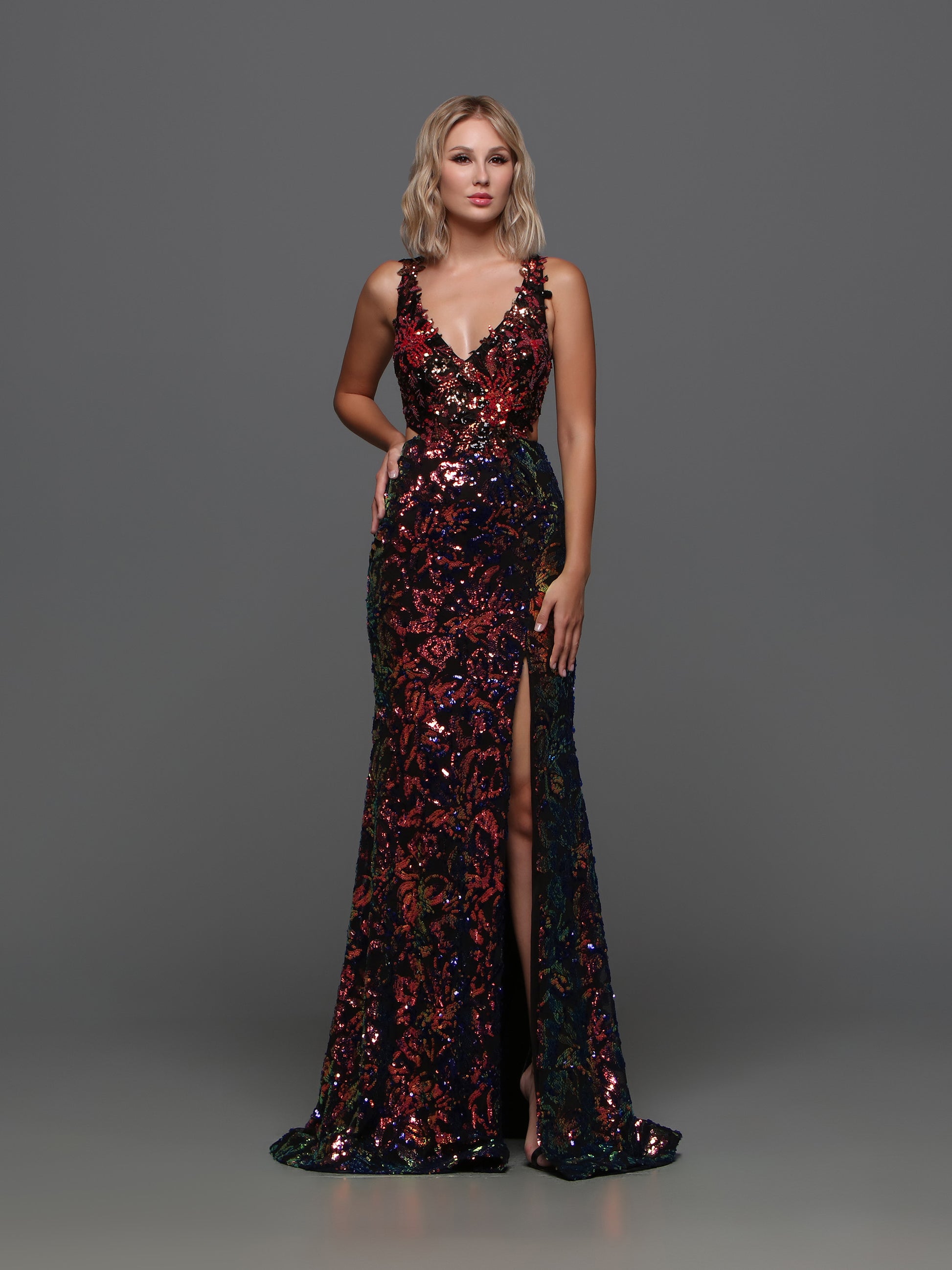 Be the shining star of the prom in the Candice Wang 72372 dress. This fitted sequin gown features a V-neckline, Cutout racerback, and slit for an alluring look. The perfect combination of elegance and edge, this dress is sure to make a statement at any formal event.   Sizes: 0-20  Colors: Black/Multi