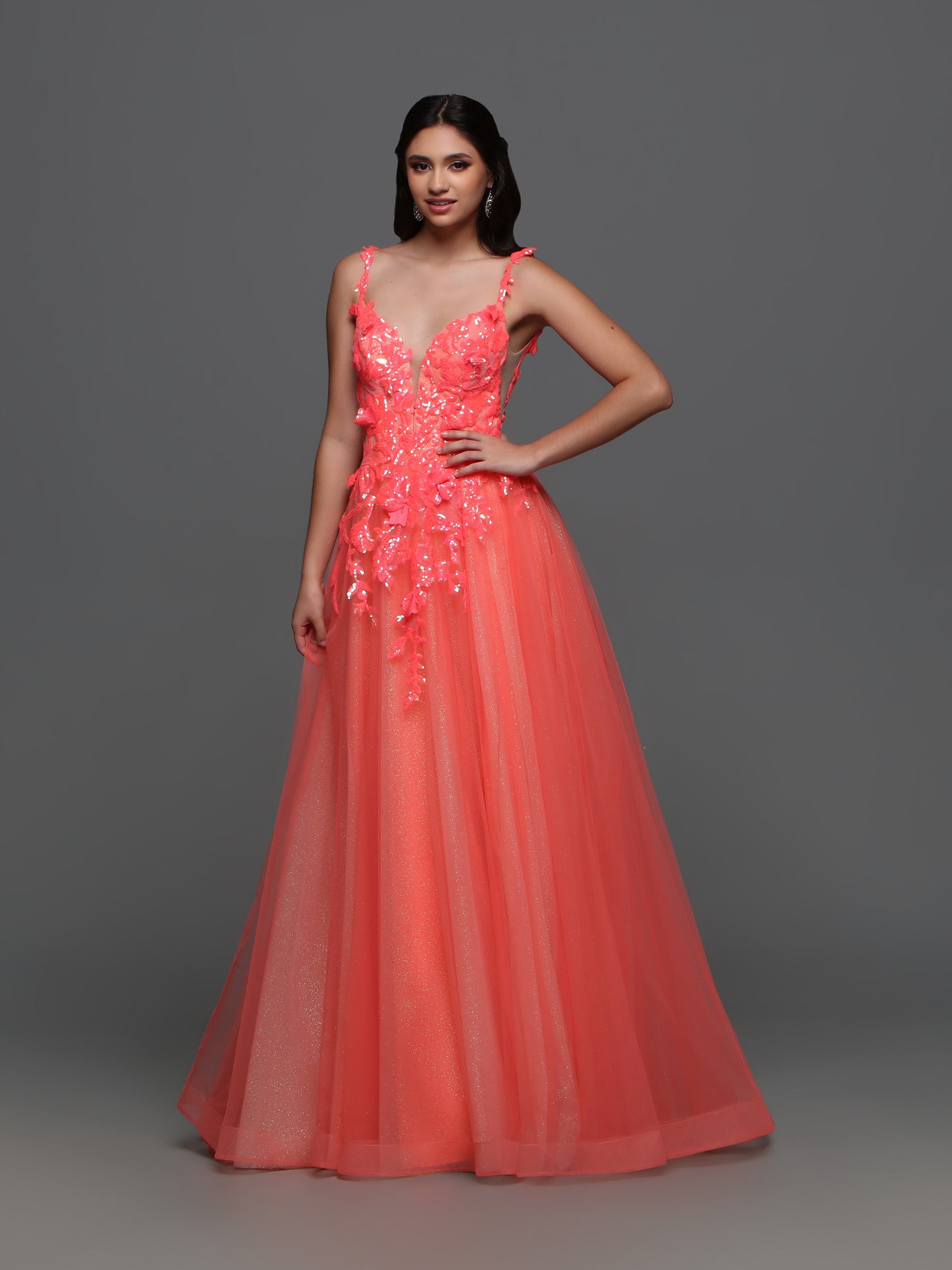 Elevate your formal look with the Candice Wang 72388 Long Shimmer Sequin Ballgown Prom Dress. The A-line silhouette and Glitter tulle details are complemented by the shimmering sequin lace, giving you an undeniable sparkle. Make a statement at your next event with this elegant and stylish dress.  Sizes: 8  Colors: Coral 