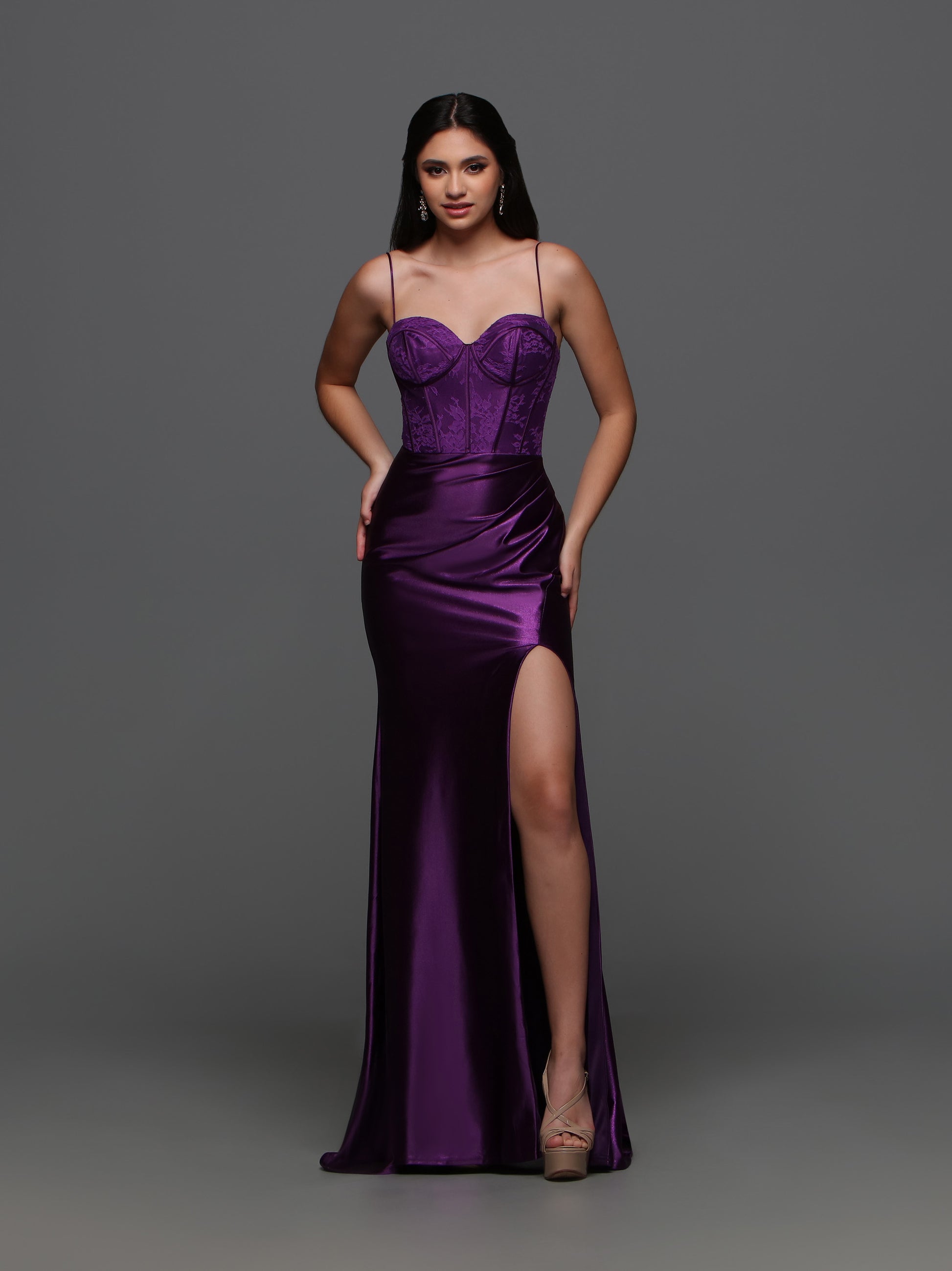 The Candice Wang 72392 Lace Corset Satin Dress is the perfect choice for your formal event. The fitted silhouette and corset lace detailing accentuate your figure, while the cut out back and slit add a touch of elegance. Made with high quality satin, this dress is both comfortable and luxurious.  Sizes: 0-16  Colors: Purple, Royal