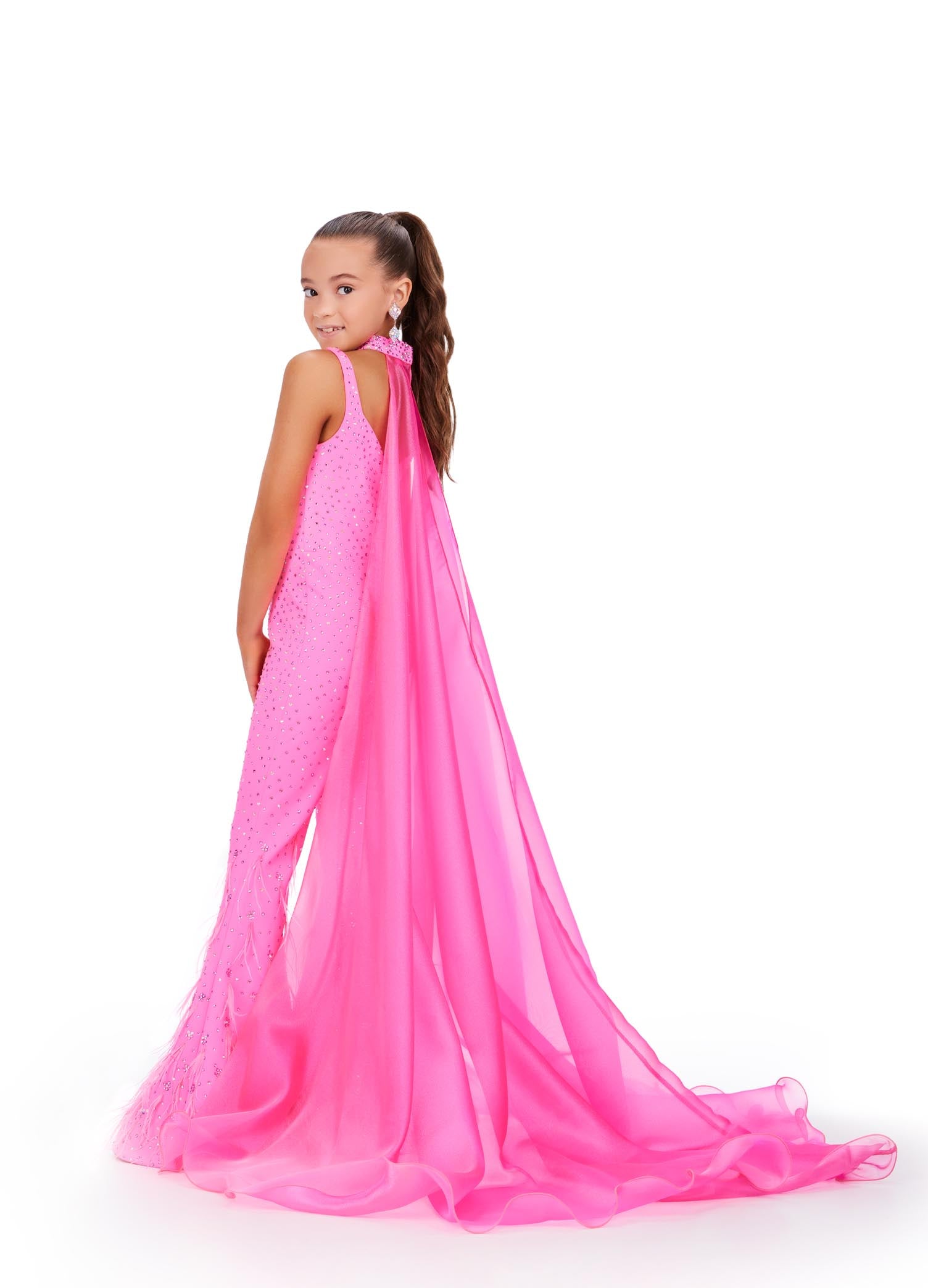 Ashley Lauren Kids 8210 Long Girls Pageant Jumpsuit with Crystal embellishements and a scoop neckline. Feather Embellished flared Bell Bottoms with a choker embellished with crystals and organza Cape.  Sizes: 14  Colors: Hot Pink