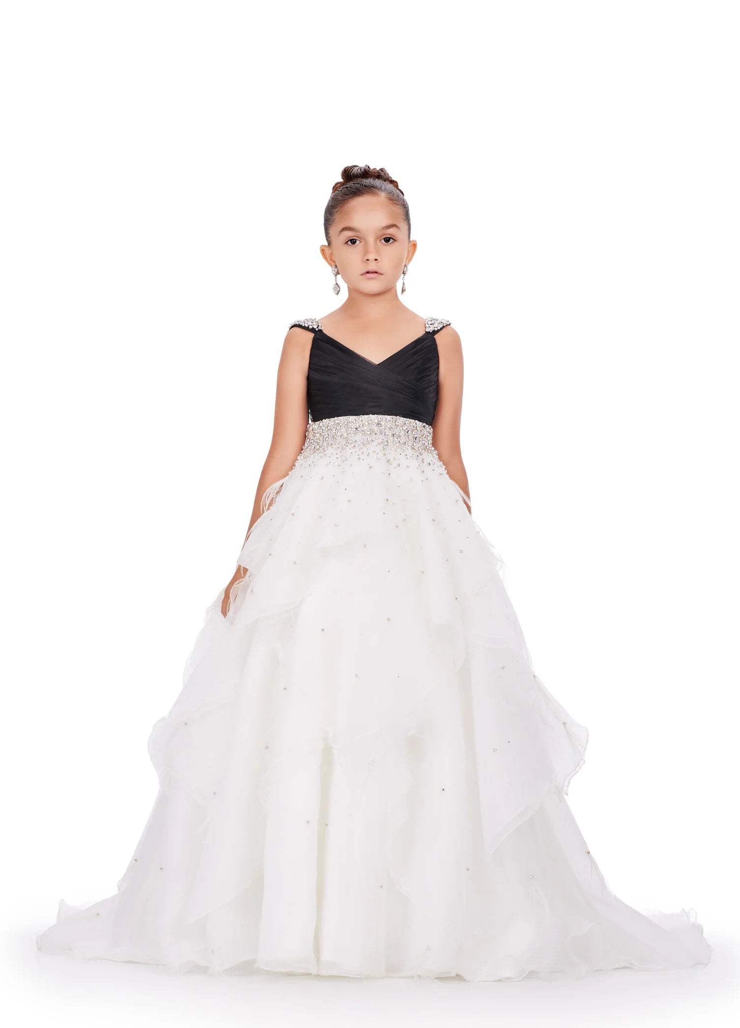 Elevate your little one's pageant look with the Ashley Lauren Kids 8219 Girls Layered Feather Pageant Dress. This stunning ballgown features a V-neck embellished with feathers, adding a touch of glamour to the overall design. With its layered skirt, this dress will make your child feel like a princess on stage. Be the star of the show in this fabulous organza ball gown