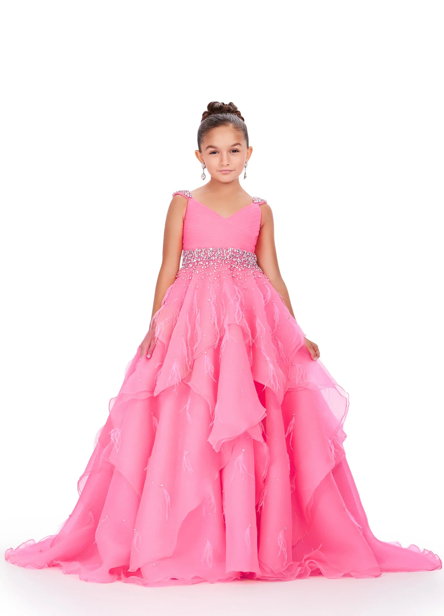 Elevate your little one's pageant look with the Ashley Lauren Kids 8219 Girls Layered Feather Pageant Dress. This stunning ballgown features a V-neck embellished with feathers, adding a touch of glamour to the overall design. With its layered skirt, this dress will make your child feel like a princess on stage. Be the star of the show in this fabulous organza ball gown