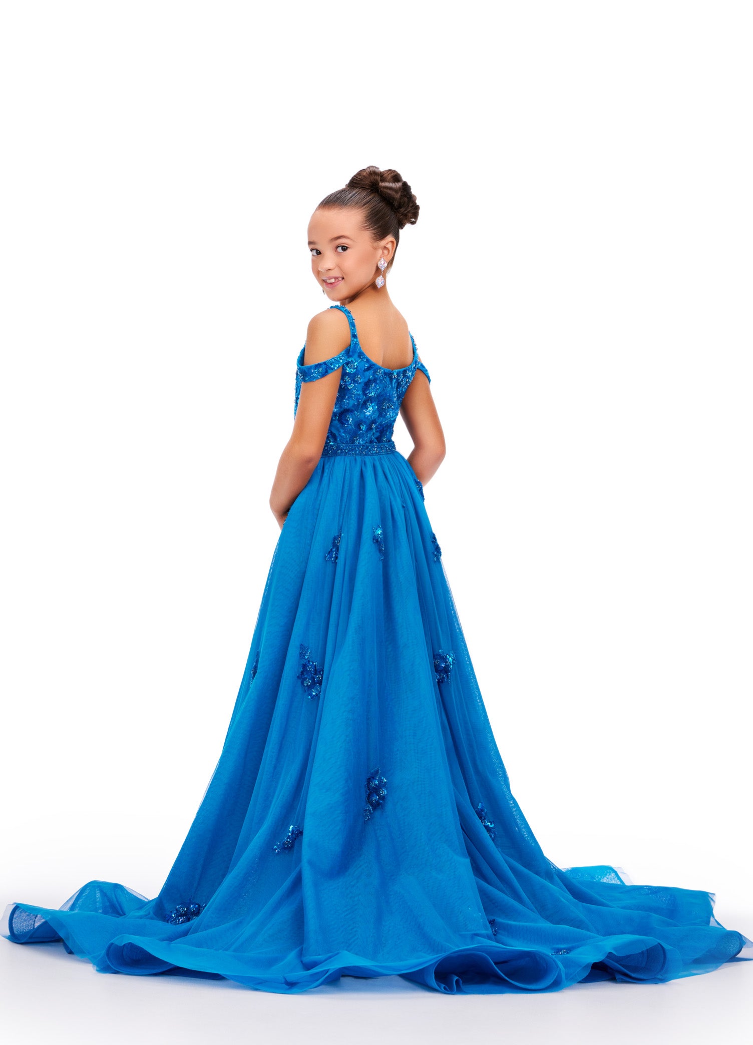 Expertly crafted for little girls who deserve to sparkle, the Ashley Lauren 8239 dress will make her shine on stage. The fitted silhouette flatters any figure while the beaded details and sequin overlay add a touch of glamour. Perfect for pageants and formal events. Bring the drama in this beaded column gown with shoulder draping straps. The removeable tulle overskirt is embellished with scattered beaded accents.