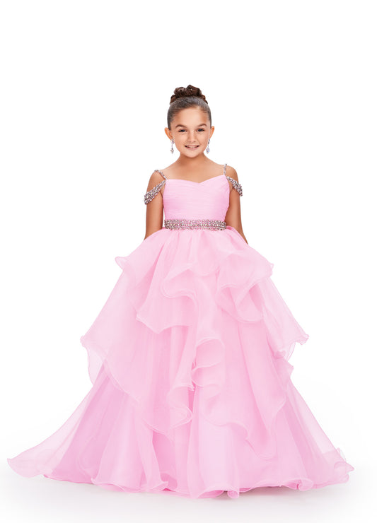 Glam up your little one's pageant look with the Ashley Lauren Kids 8250 A Line Ruffle Dress. This stunning ballgown features a delicate off-the-shoulder neckline, adorned with intricate beading. The ruffled A-line skirt adds a touch of elegance, making your child shine on stage. Perfect for any formal occasion. 