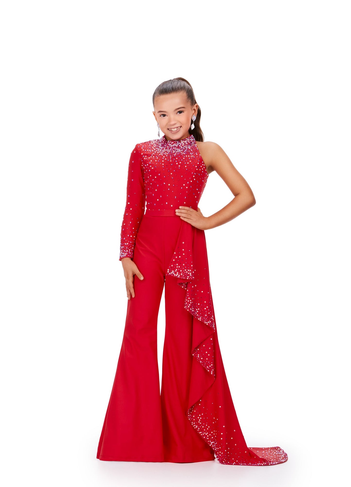 Presenting the Ashley Lauren Kids 8253 Girls Pageant Jumpsuit, featuring a stunning ruffle train and bell bottom pants. This elegant pant suit offers long sleeves for comfort and style, perfect for your little star's big moment. Elevate her confidence and charm on stage with this chic and timeless design. Bring the sass in this high neckline jumpsuit with one sleeve