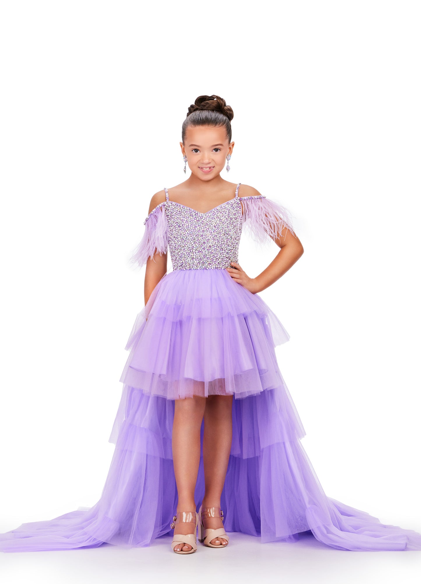 This Ashley Lauren Kids 8259 dress features layered tulle, a high low style, and an off the shoulder design with delicate feather accents. Perfect for pageants, your little girl will look stunning and feel confident in this unique and elegant dress. This fun & flirty kids tulle tiered high low features off the shoulder feather straps and a crystal encrusted bodice