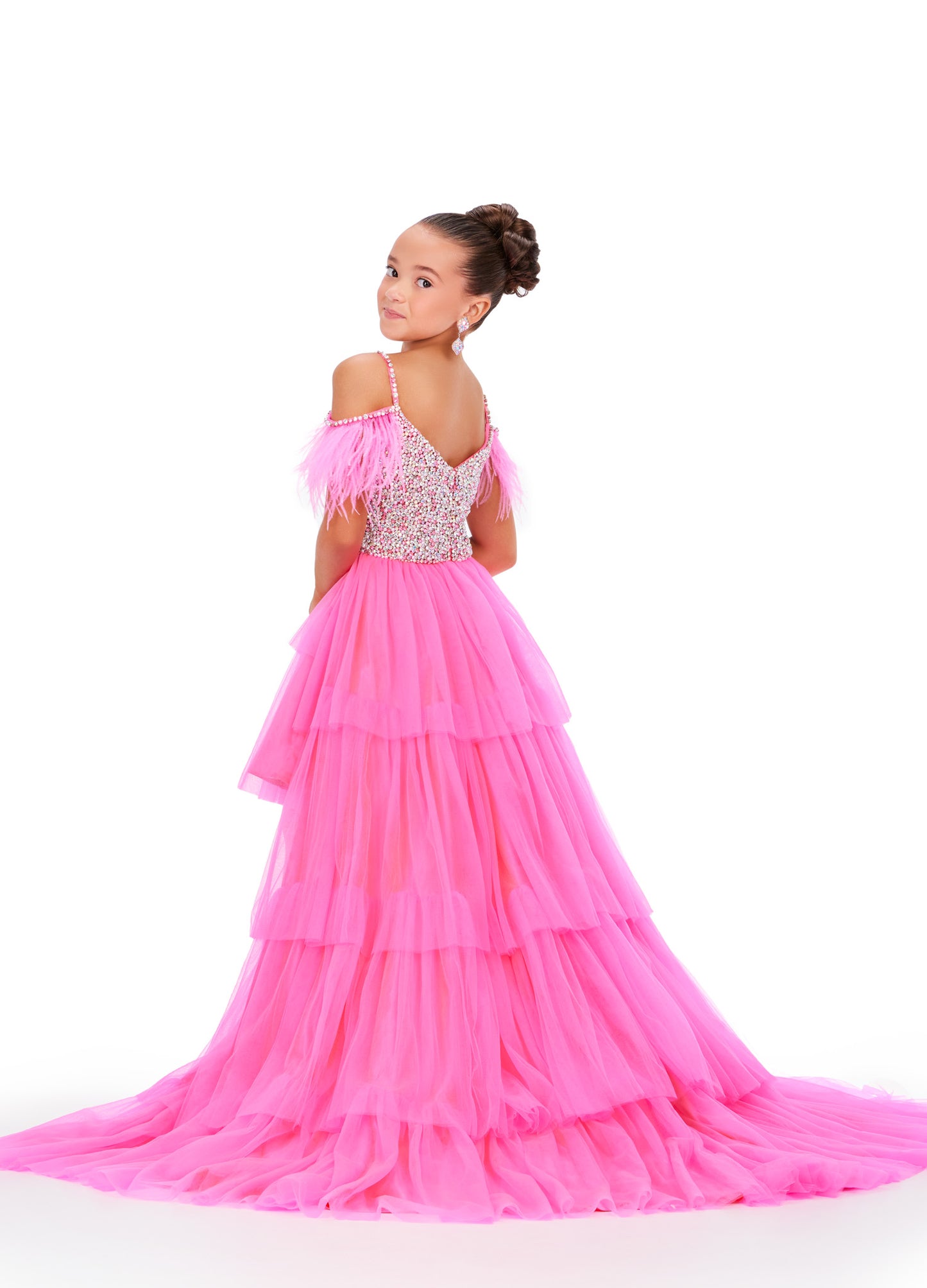 This Ashley Lauren Kids 8259 dress features layered tulle, a high low style, and an off the shoulder design with delicate feather accents. Perfect for pageants, your little girl will look stunning and feel confident in this unique and elegant dress. This fun & flirty kids tulle tiered high low features off the shoulder feather straps and a crystal encrusted bodice