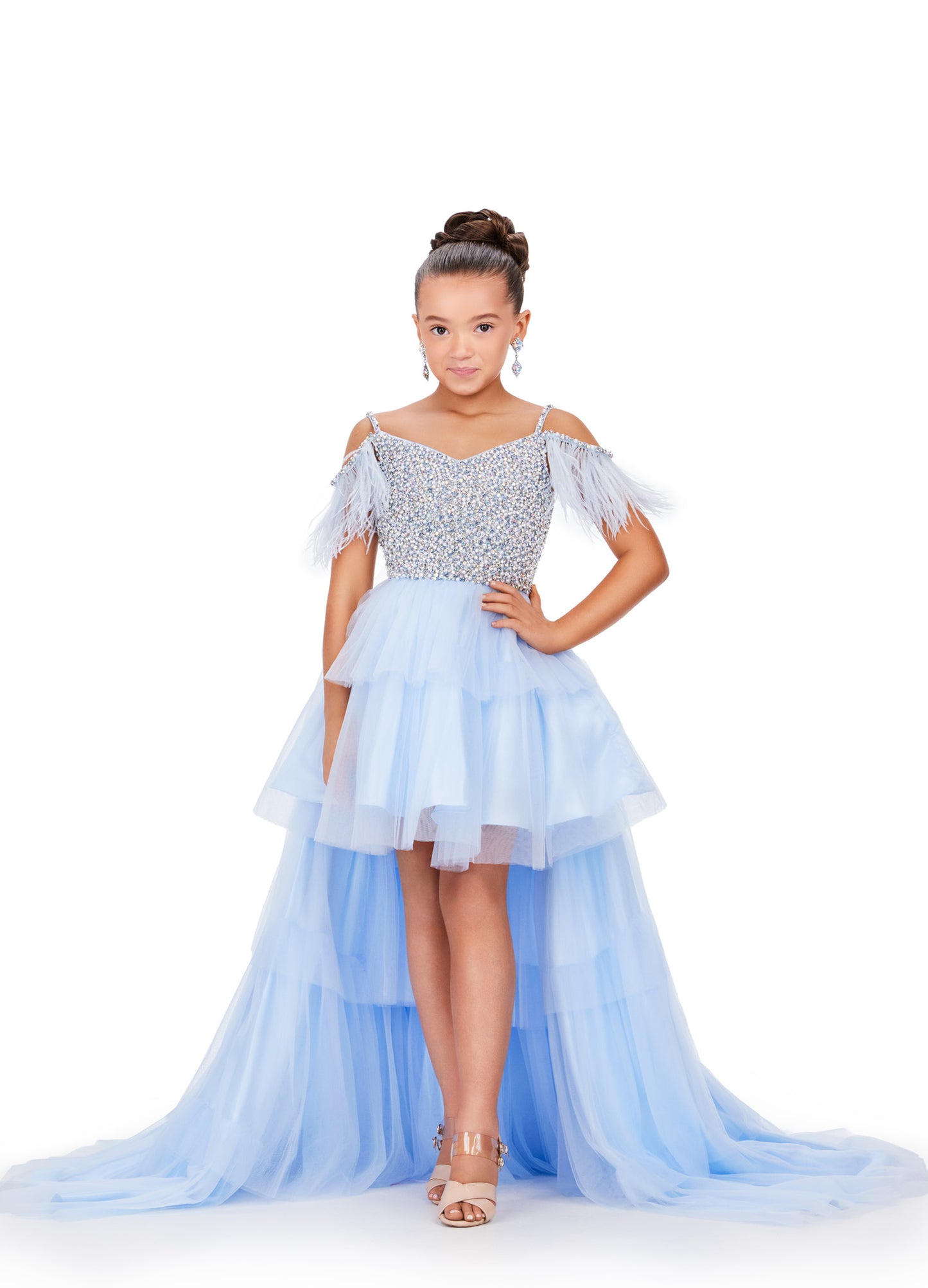 This Ashley Lauren Kids 8259 dress features layered tulle, a high low style, and an off the shoulder design with delicate feather accents. Perfect for pageants, your little girl will look stunning and feel confident in this unique and elegant dress. This fun & flirty kids tulle tiered high low features off the shoulder feather straps and a crystal encrusted bodice