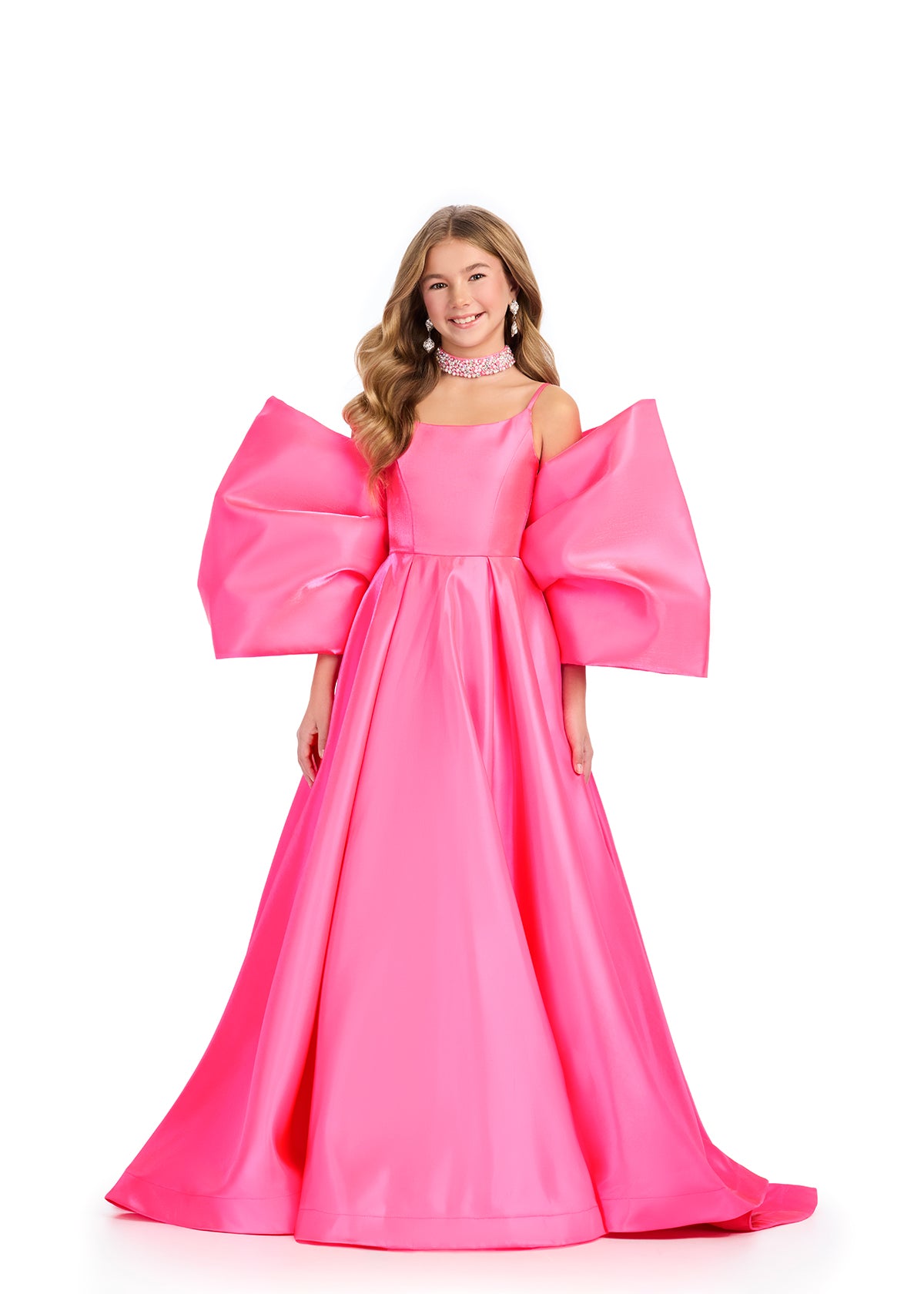 Introducing the Ashley Lauren Kids 8321 Oversize Bow Overskirt Pageant Accessory off the Shoulder Cape - the perfect addition to any pageant ensemble. The oversized bow and off the shoulder design add a touch of elegance and modernity to any outfit. Feel confident and glamorous on stage with this versatile accessory.&nbsp; Transform any outfit into a statement piece with this enchanting bow overskirt. This overskirt adds the perfect amount of glamour to any ASHLEYlauren cocktail dress, jumpsuit or dress.

B