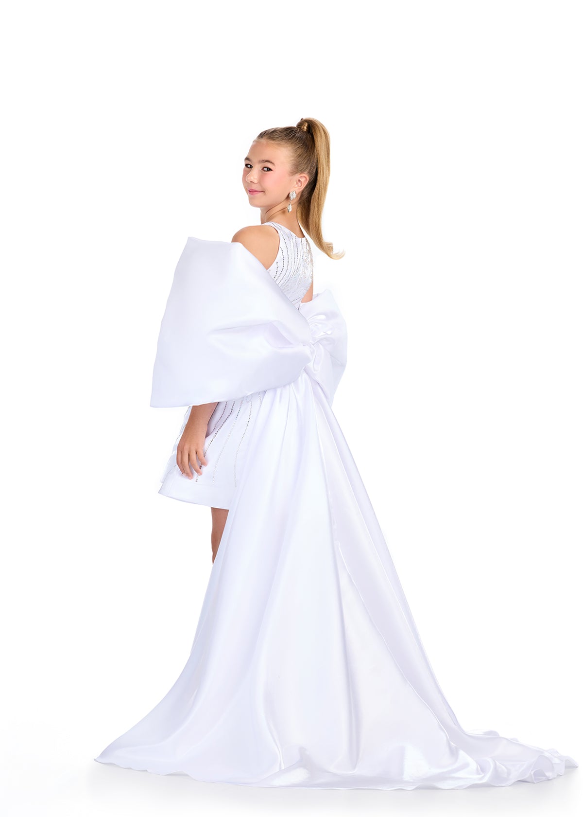 Introducing the Ashley Lauren Kids 8321 Oversize Bow Overskirt Pageant Accessory off the Shoulder Cape - the perfect addition to any pageant ensemble. The oversized bow and off the shoulder design add a touch of elegance and modernity to any outfit. Feel confident and glamorous on stage with this versatile accessory.&nbsp; Transform any outfit into a statement piece with this enchanting bow overskirt. This overskirt adds the perfect amount of glamour to any ASHLEYlauren cocktail dress, jumpsuit or dress.

B