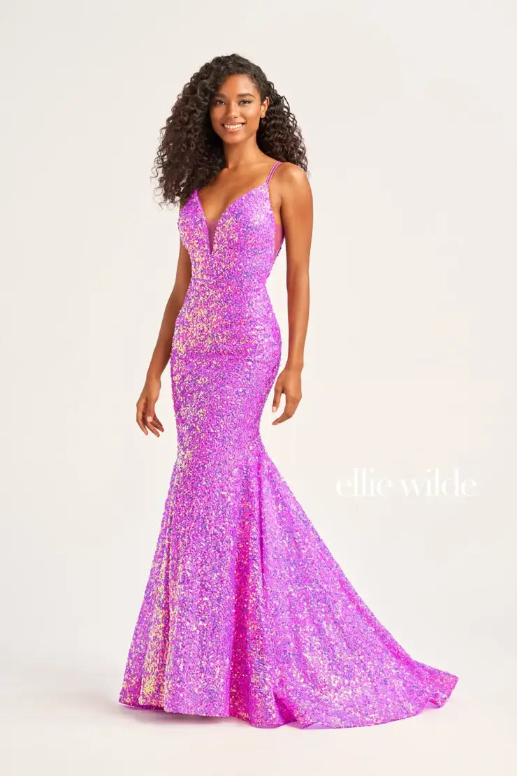 Look sophisticated and graceful in Ellie Wilde EW34016. The signature Iridescent color shifting sequins and mermaid silhouette make this timeless corset dress a perfect choice for a formal occasion. Captivate everyone in the room with its sparkling iridescent material and backless v-neckline.  Sizes: 16  Colors: FOREST LIGHT  https://dy9ihb9itgy3g.cloudfront.net/static/themes/EllieWilde/Spring_2023/EW34016.mp4