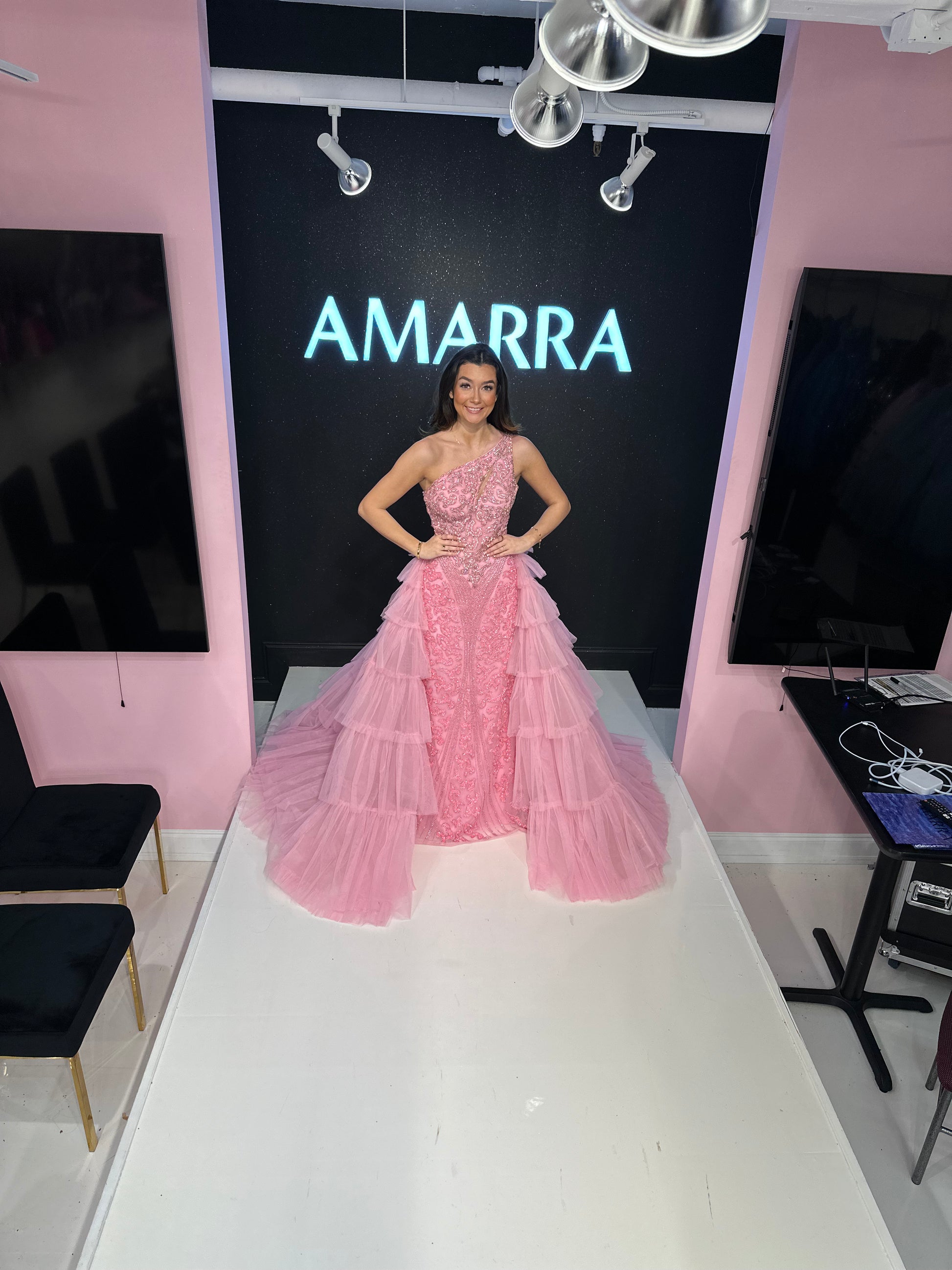 Introducing the Amarra 88147 Beaded One Shoulder Pageant Dress. With intricate beading and a tiered overskirt, this formal gown exudes elegance and sophistication. The crystal detailing adds a touch of sparkle, making you stand out at any event. Elegant tiered tulle gown with intricate crystals and sequin, and a flattering one shoulder neckline. 