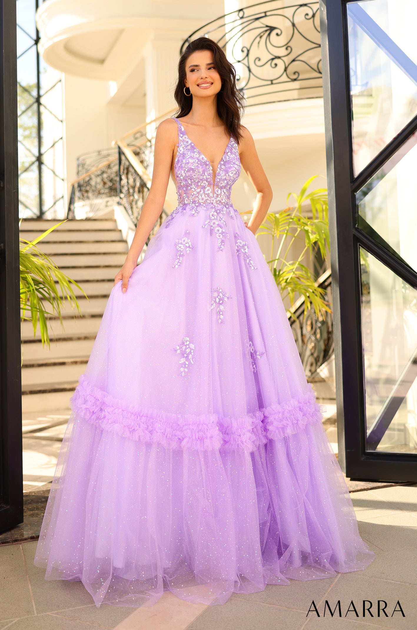 Elevate your formal look with the Amarra 88744 Long Shimmer Ballgown. This stunning dress features intricate sheer sequin detailing and a ruffled tulle A-line skirt that exudes elegance. Perfect for prom or any special occasion, this dress will make you stand out in style. Behold the exquisite prom dress that embodies a floral fantasy and stands as a true work of art.