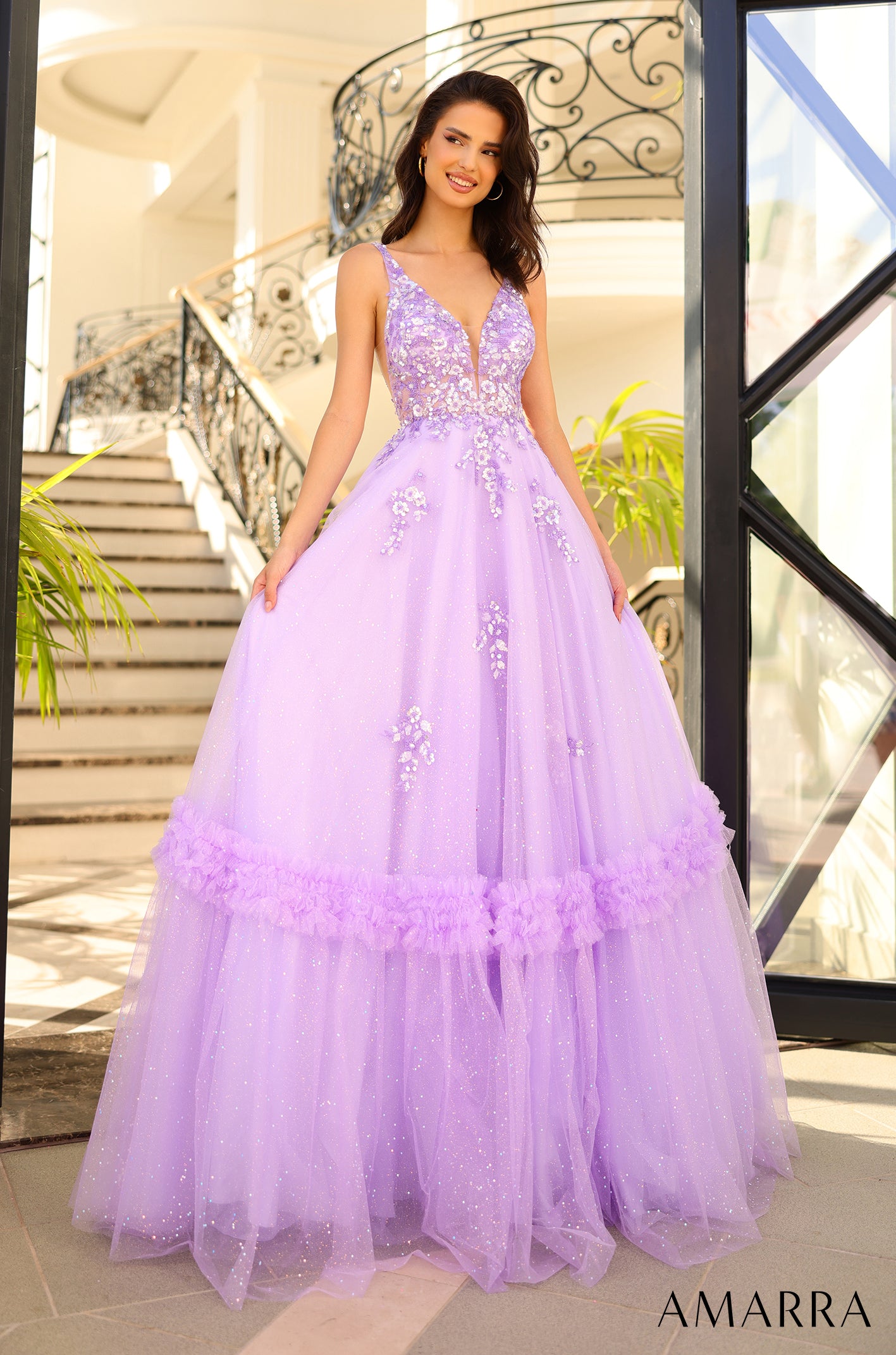 Elevate your formal look with the Amarra 88744 Long Shimmer Ballgown. This stunning dress features intricate sheer sequin detailing and a ruffled tulle A-line skirt that exudes elegance. Perfect for prom or any special occasion, this dress will make you stand out in style. Behold the exquisite prom dress that embodies a floral fantasy and stands as a true work of art.