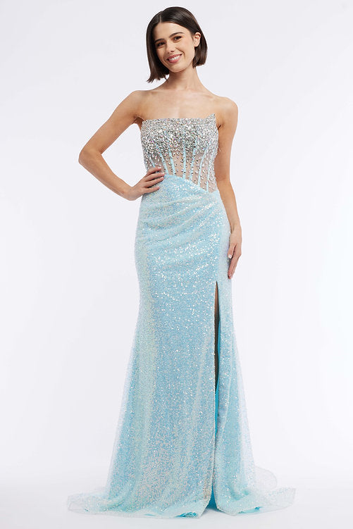 The Vienna Prom 8885 offers a timeless, glamorous look. Perfect for proms, pageants, and special occasions, this sheer corset gown features sequins, slit, and ruched waist for an unforgettable silhouette. The peak points cutout side adds sparkle and detail. Make a statement in this timeless, sparkling style.