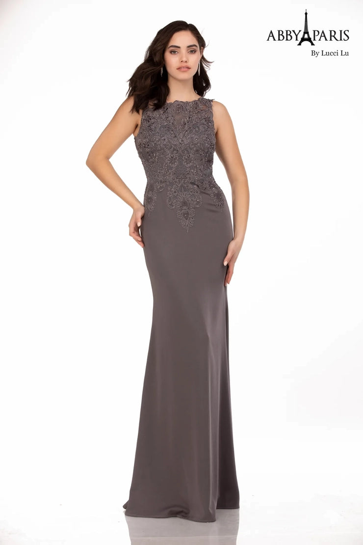 Abby Paris 96061W Lace Bodice Stretch Crepe A-Line High Neck Plus Size MOB Formal Gown. Glam up your special occasion with the Abby Paris 96061W Lace Bodice Stretch Crepe A-Line High Neck Plus Size MOB Formal Gown. This beautiful dress is designed with a lace bodice made of stretch crepe for a comfortable fit and features a high neck, A-Line silhouette, and beaded waist. Perfect for weddings or formal events.