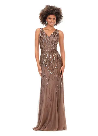 Ashley Lauren 11204 V-Neck Sequin V-Back Hand Beaded Sheer Long Evening Dress. This classic fitted gown features a v-neckline, v-back and a flattering bead pattern.