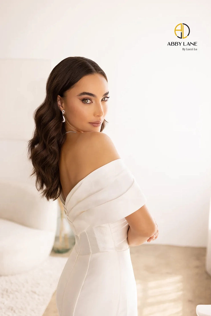 Crafted with Satin and lace, the Abby Lane Bridal 97179 Ivory Gown is a stunningly beautiful A-Line dress with wide, off the shoulder straps. Its train is delicately trimmed with lace for a sophisticated look. Perfect for the special day.  Color:  Ivory