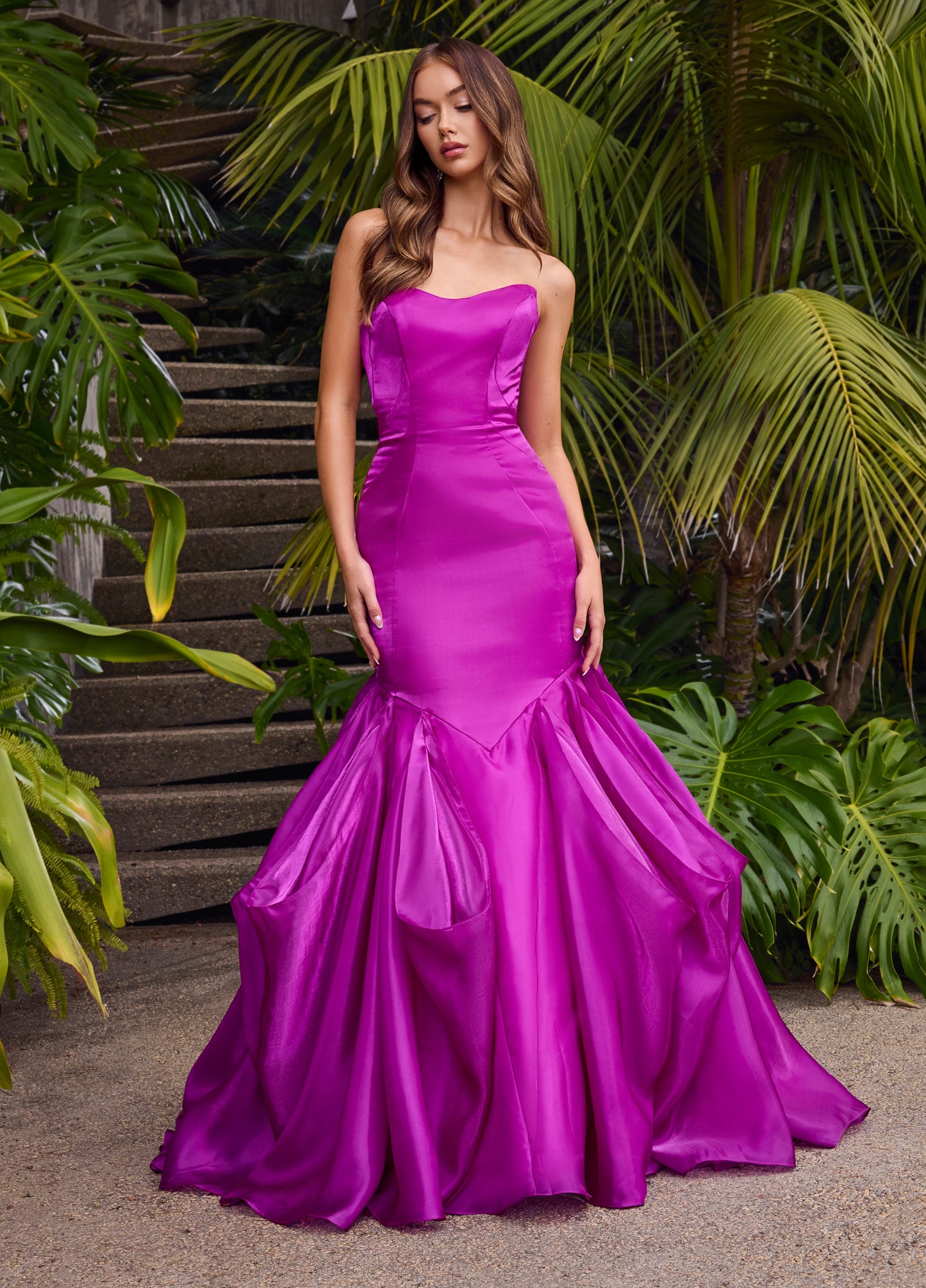 Ashley Lauren 11733 Shiny Organza Mermaid Evening Gown. This elegant gown features a fit and flare silhouette, ruffle skirt, and strapless sweetheart neckline. Made with luxurious shiny organza material, this gown exudes sophistication and exclusivity for a truly unforgettable look.