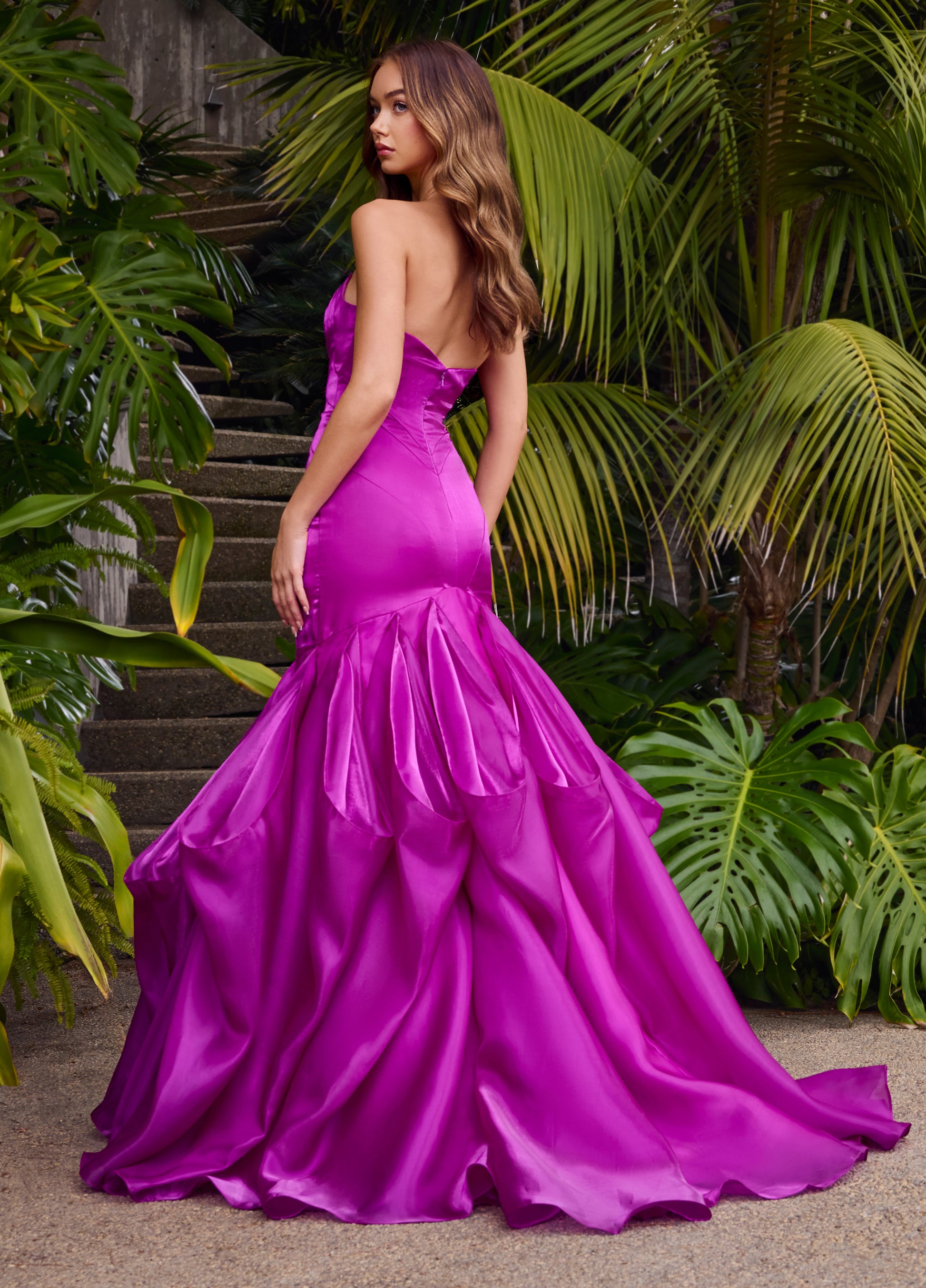 Ashley Lauren 11733 Shiny Organza Mermaid Evening Gown. This elegant gown features a fit and flare silhouette, ruffle skirt, and strapless sweetheart neckline. Made with luxurious shiny organza material, this gown exudes sophistication and exclusivity for a truly unforgettable look.