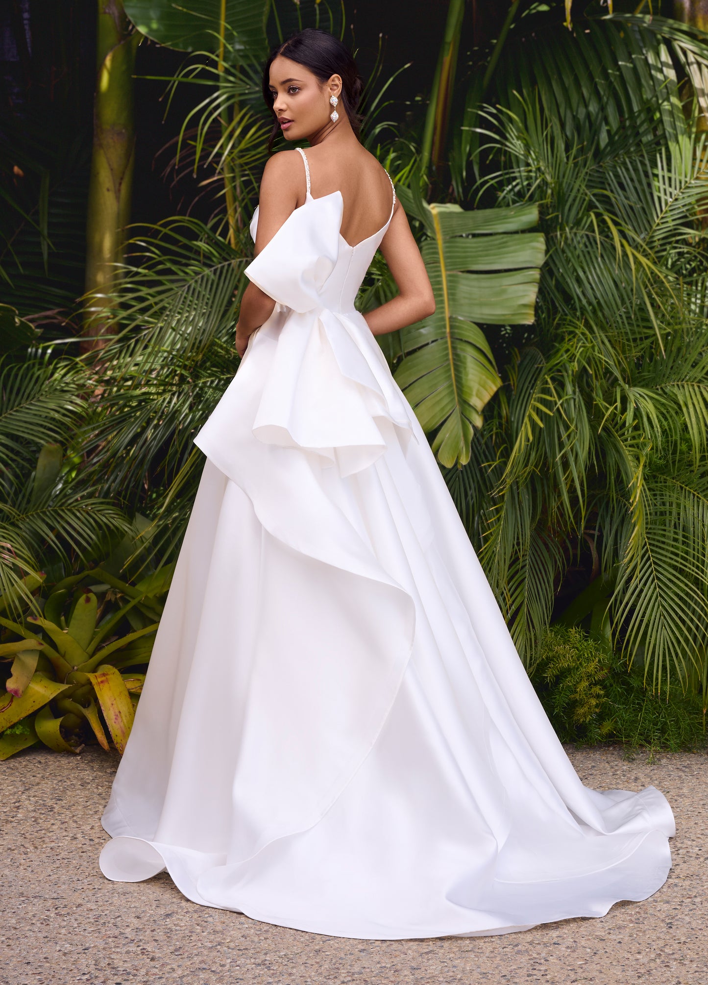 Elevate your evening look with the Ashley Lauren 11769 Satin Ballgown. This stunning and sophisticated gown features a sweetheart neckline, ruched bodice, and a full skirt with a train. The satin fabric adds a luxurious touch, while the bow detail adds a feminine and elegant touch. Perfect for any formal occasion.