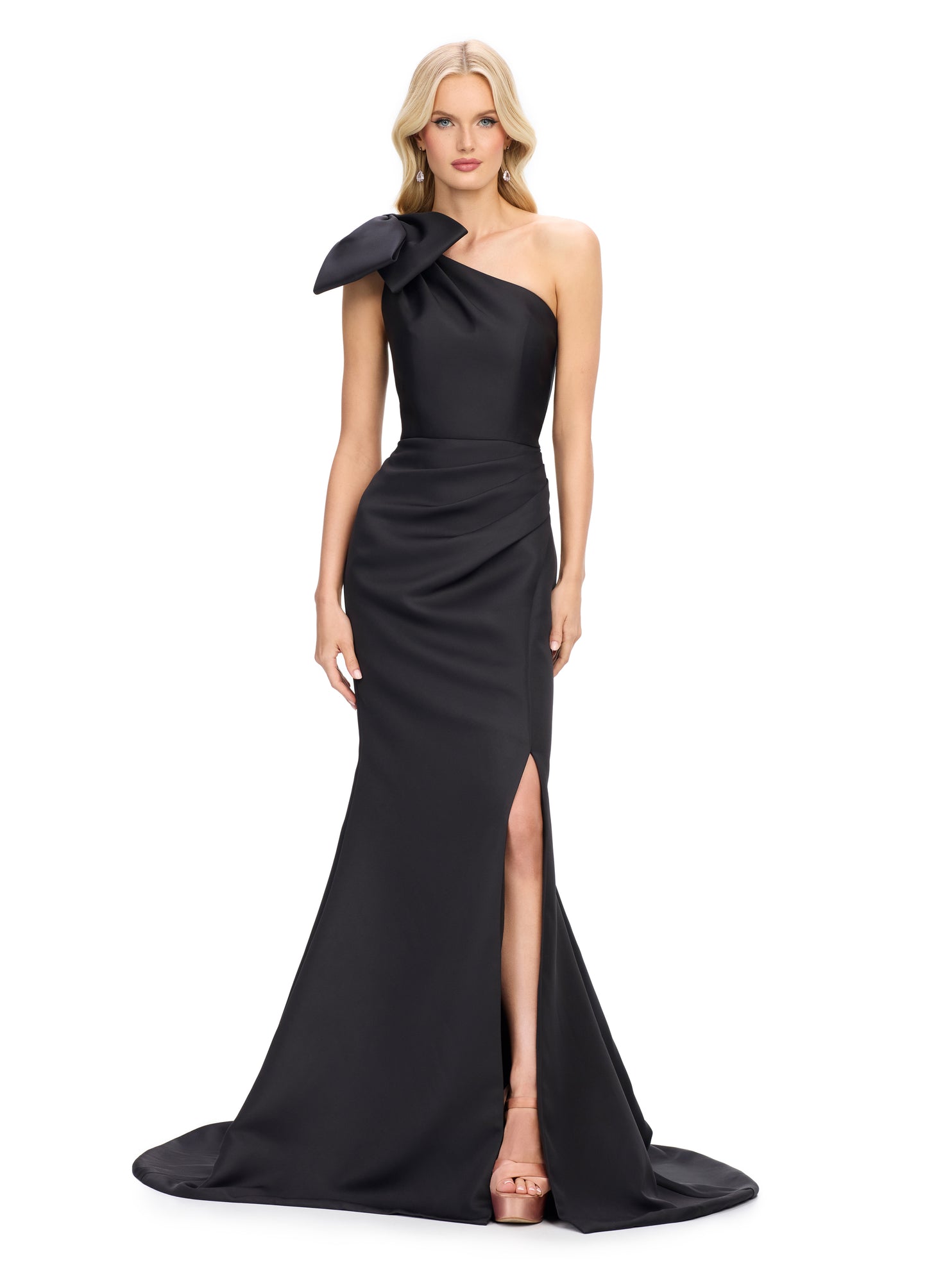 This Ashley Lauren satin evening gown combines elegance with modern details. The one shoulder design and bow add a touch of sophistication, while the ruched waist and short slit provide a flattering fit and added comfort. Perfect for any special occasion, this gown is sure to make you look and feel stunning.