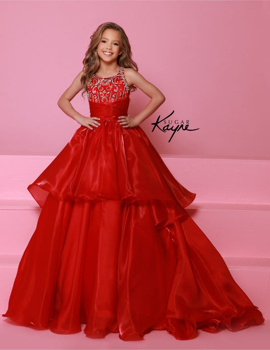 Experience the ultimate in luxury and style with the Sugar Kayne C378 Shimmer Girls Pageant Dress. The A Line Layer design is enhanced with a beaded bodice and a train for added drama. The high neck adds a touch of elegance, making this dress perfect for any pageant or formal event. Embrace your inner star with this show-stopping mirror organza ballgown. The sophisticated, beaded neckline and shimmering fabric ensure you’ll mesmerize the judges with your poise and elegance.

Sizes: 2-16

Colors: Cherry, Mag