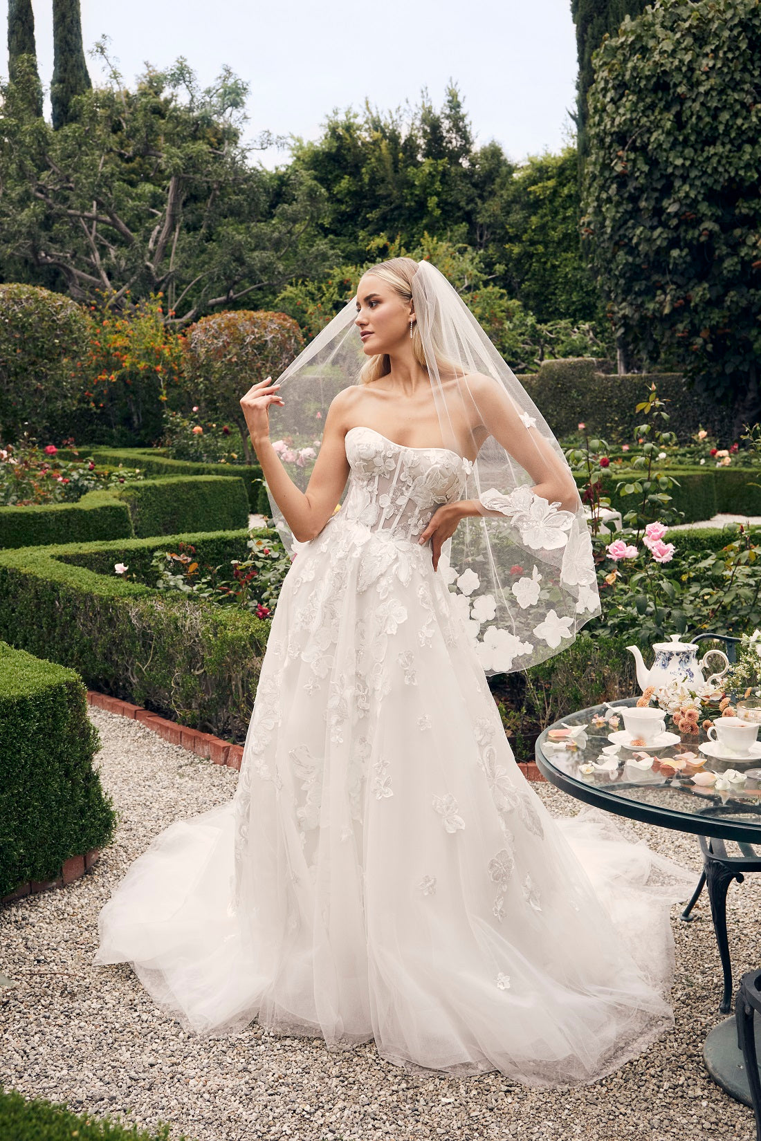 Casablanca Bridal 2540 Elloise A-Line Ballgown Strapless Sheer Floral Corset Sweetheart Neckline Open Back Train Wedding Gown. Prepare to be swept away by the ethereal beauty of Style 2540 Elloise, our exquisite A-line wedding dress.